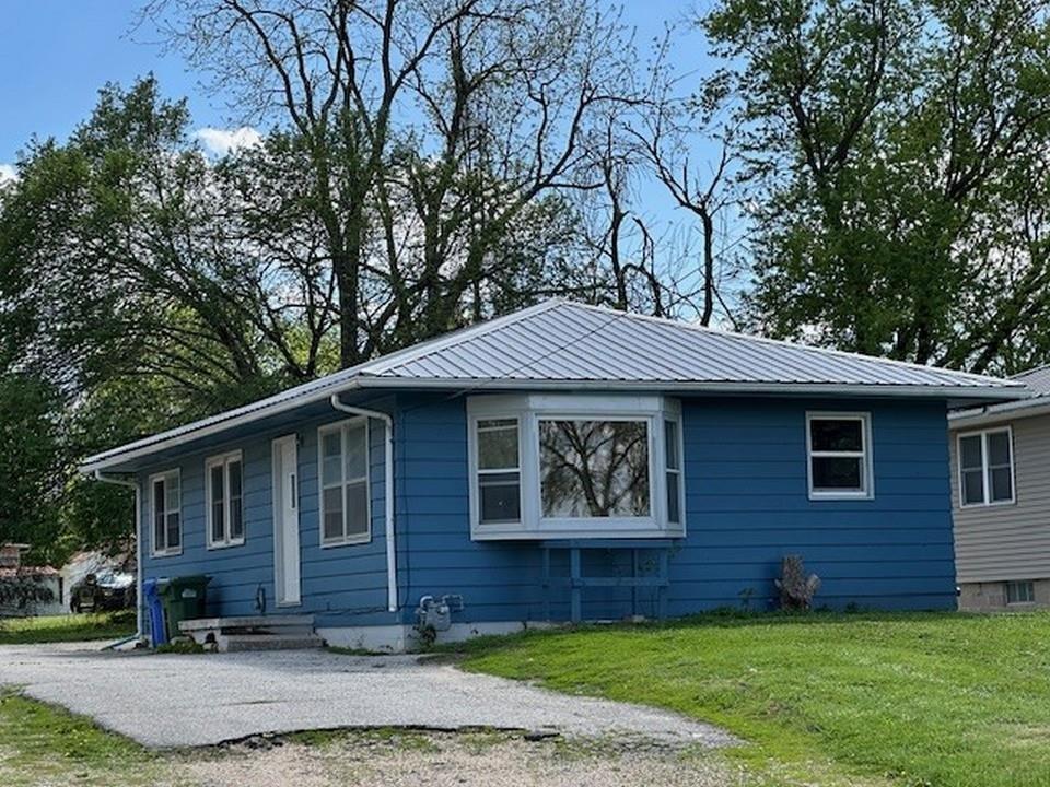 Versatile investment or owner-occupant opportunity offering strong value-add potential with light renovation. This 1963-built property features approximately 1,443 finished square feet and flexible floor plan configurations to suit a variety of needs: option for 4 bedrooms, 2 baths with dual living areas, or 5 bedrooms, 2 baths with a single living space. Additional highlights include an eat-in kitchen with included appliance package, lower-level laundry, a permitted metal roof (2006), and replacement windows (2012). Ideally situated near Wartburg College Campus, Hertel Baseball Field, and the W Sports & Wellness Center and more. Immediate possession available—schedule your private showing today.