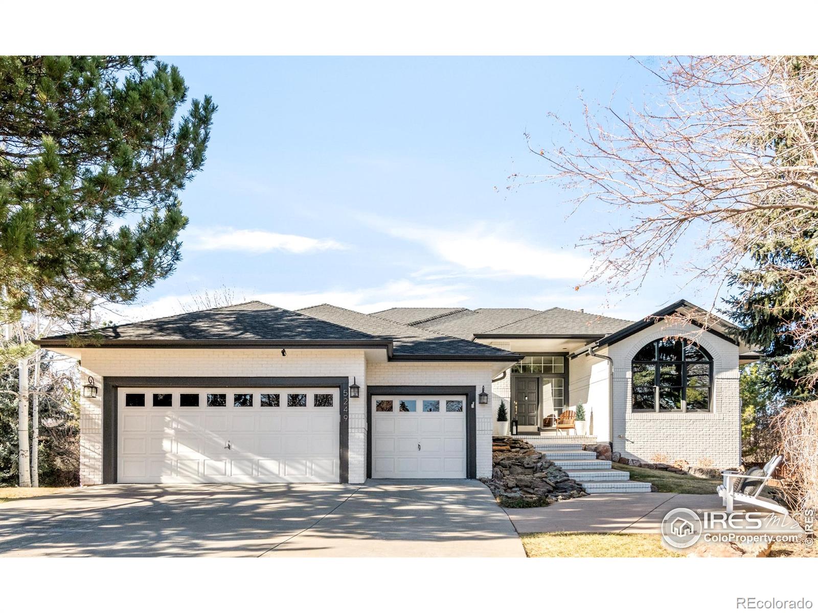 OPEN HOUSE Saturday, 1/17, 1-3 PM. Nestled on a quiet cul-de-sac in Country Club Estates, this Gunbarrel residence embodies privacy, elegance and thoughtful modernization. Framed by evergreen trees and winter Flatiron views, this custom ranch-style home unfolds with bright, open living spaces crowned by soaring 10-12-foot ceilings. More than $200k in upgrades elevate everyday living, including fresh paint, new flooring, modern trim and hardware, custom metal railings and a striking fireplace with stone surround. The kitchen shines with granite countertops, warm wood cabinetry and new stainless steel appliances, while the luxurious main-floor primary suite offers serene comfort. Generous storage includes a 550-sq-ft lower-level room and a heated, oversized three-car garage with new Penntek polyurea flooring. Outdoor living is exceptional with a park-like .37-acre lot, front water feature, flagstone patio, built-in fire pit, retaining wall, and low-maintenance deck with glass and metal railing. Community amenities, including a pool, park, tennis and volleyball courts, complete this rare opportunity just moments from Boulder Country Club. Residents have the option to choose between top-rated high schools (Fairview or Boulder).