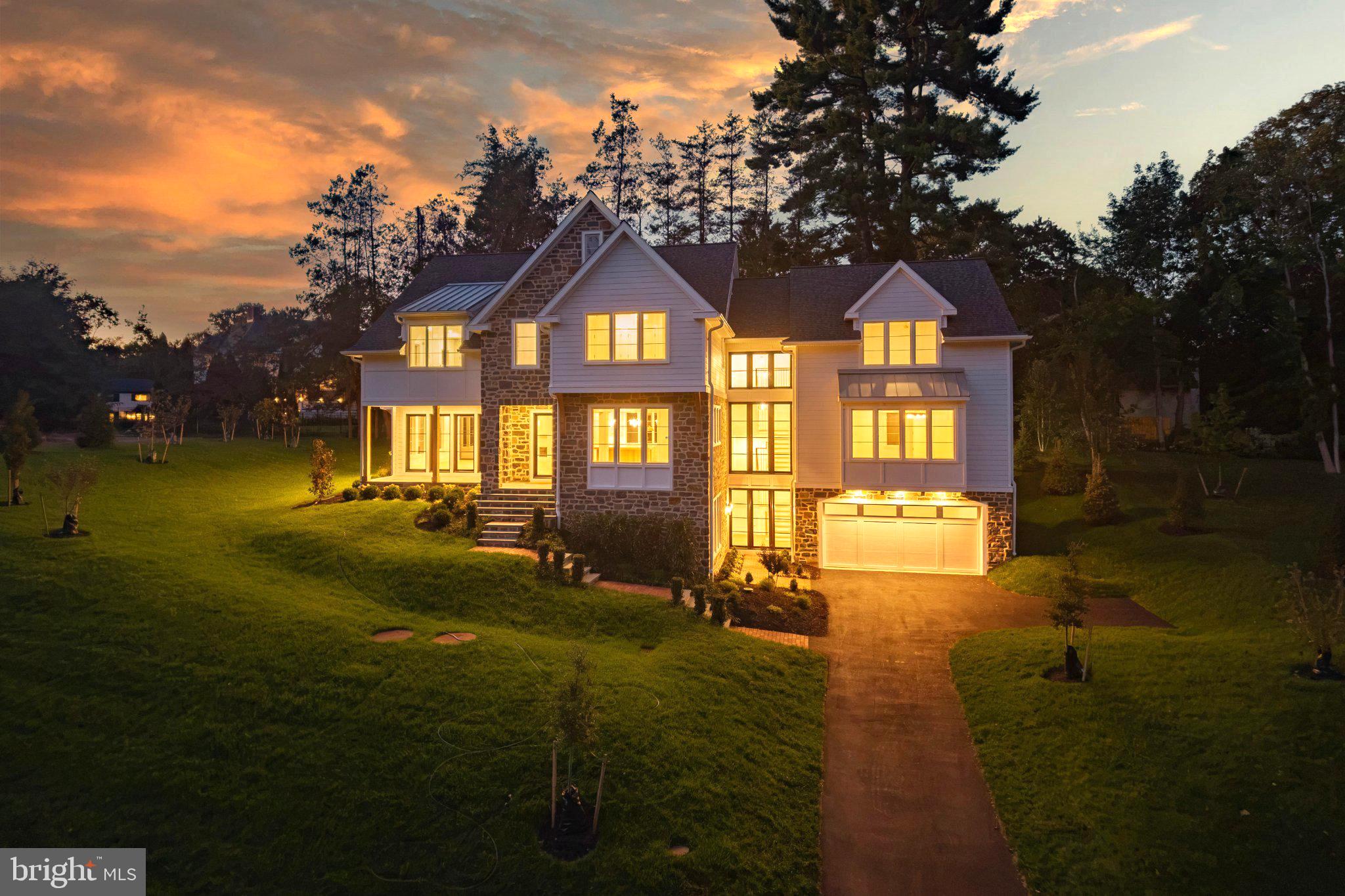NEW, Flexible Luxury with Architectural Distinction on the Main Line! Introducing 25 Sandringham Road, (Lot #2), an exceptional, upscale, Quick-Delivery Model nestled on a private cul-de-sac within Sandringham, one of Lower Merion Township's most picturesque and exclusive enclaves. Ready for you to host holiday gatherings! (Some customization for personal needs may be possible.) Thoughtfully designed for today's evolving lifestyles, this sophisticated transitional manor blends timeless Main Line elegance with modern functionality, offering rare adaptability for multi-generational living, live-in care, extended guest stays, or work-from-home convenience. Step away from cookie-cutter standards and seize the opportunity to style this bespoke, architectural showpiece. A dramatic staircase wrapped in wall of glass serves as the architectural centerpiece of the home, connecting three levels of beautifully crafted living space flooded with natural light. Rich white oak flooring, soaring 10-foot ceilings, custom millwork/ceiling treatments, designer lighting, artisan tile selections, exquisite stone, and handcrafted Kountry Kraft cabinetry create an atmosphere of understated luxury throughout.The main level unfolds with an open-concept design tailored for both everyday living and grand entertaining. A spectacular great room anchored by a striking gas fireplace flows seamlessly into the chic chef's kitchen, where an oversized gathering island, premium finishes, and abundant workspace invite family and friends to connect. A window-lined morning lounge opens to a spacious covered porch, extending the living experience outdoors.One of the home's most compelling features is its exceptional versatility. A private study provides the ideal executive retreat, while a main-level guest suite with adjacent full bath offers multi-function usage as  secondary office, hospitality suite, or live-in accommodation. Every level of the residence includes the possibility of a bedroom and full bath, creating unmatched comfort and privacy for family members and guests alike. The upper level presents five bedrooms and four full baths, highlighted by an extraordinary owner's retreat. Elevated by an impressive, oak beam-accented, 11.5-foot ceiling, the suite offers two custom walk-in closets and a spa-inspired bath featuring heated tile floors, a freestanding soaking tub, oversized dual-head shower, custom tile work, and refined designer finishes that evoke the ambiance of a luxury boutique resort.Perfectly positioned on a scenic, cul-de-sac home site within the highly acclaimed Lower Merion School District, 25 Sandringham offers the rare combination of a tranquil residential setting with convenient access to Center City Philadelphia, the Northeast rail corridor, premier shopping, dining, private schools, parks, and recreational amenities. *Taxes shown are for lot only-assessment for full ground/improvements occurs post-settlement.* A unique opportunity to own a distinctive new construction residence where dynamic, flexible design and timeless Main Line sophistication come together beautifully.
