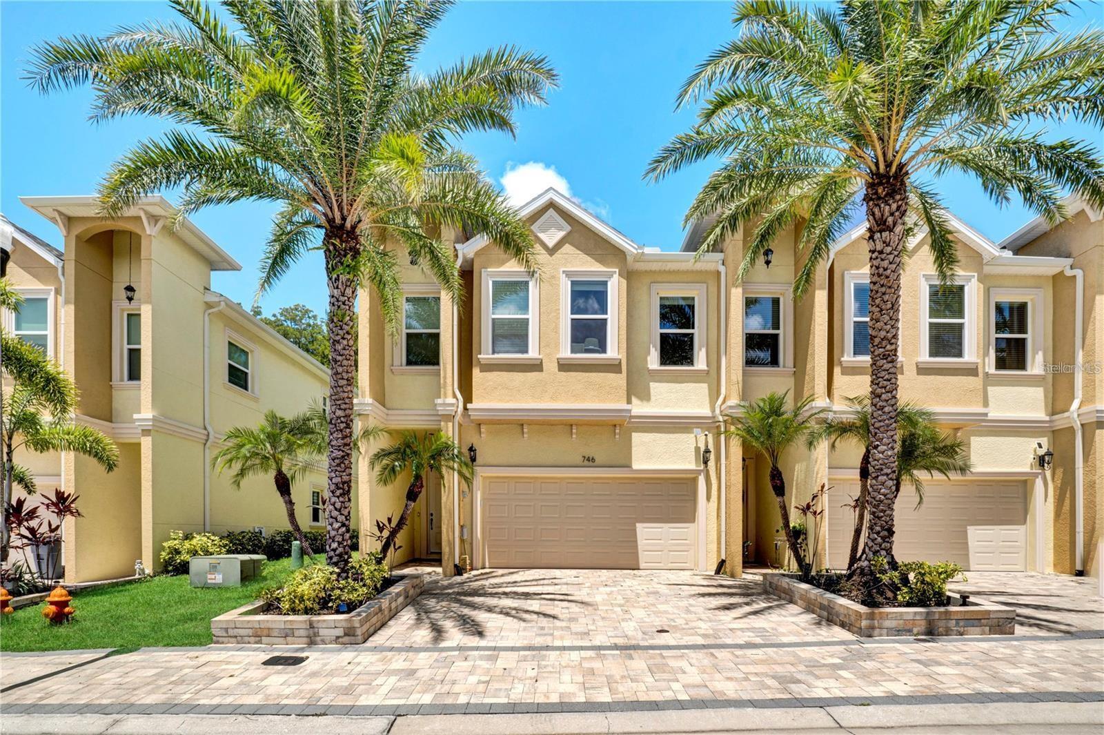 Low-Maintenance Luxury Meets Active Florida Living. Forget the weekend yard work and embrace the ultimate Florida lifestyle. Nestled in the highly sought-after Grand Cypress Trails community, this premium 3-bedroom, 2.5-bathroom end-unit townhouse offers the perfect blend of modern luxury, privacy, and convenience. Built in 2022 and completely move-in ready, this home is designed for those who want a sophisticated, "lock-and-leave" lifestyle just minutes from world-class golf courses, pristine beaches, the Pinellas Trail, and historic downtown Tarpon Springs.From the paver driveway and covered entryway to the soaring ceilings inside, every detail of this home exudes quality. The main floor features an airy, open-concept layout grounded by luxury vinyl plank flooring. Whether you are hosting an intimate dinner in the elegant dining area or relaxing in the massive great room, the space flows effortlessly.Elegant plantation shutters dress the windows, while the impact-resistant sliders open up to a private, screened-in lanai. Complete with a privacy shade and a dedicated grilling area, it’s the ultimate spot to enjoy peaceful preserve views.Upstairs, the expansive primary suite serves as your personal oasis. Step out onto your private balcony to sip morning coffee or watch the sunset over the preserve. The spa-like en-suite bathroom boasts granite dual vanities with upgraded mirrors, and expansive walk-in shower and a large custom walk-in closet. Live the life you’ve earned. No mowing, no hassle—just luxury, nature, and immediate access to the best of Tarpon Springs. Schedule your private tour today!