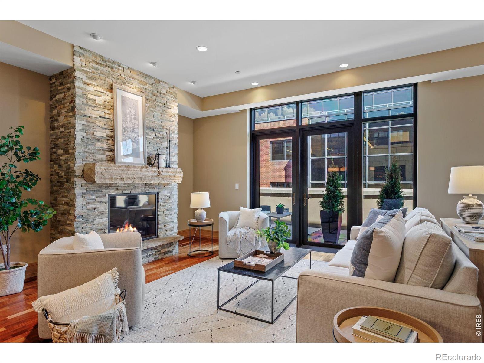 The Best Just Got Better,Value,Location,Premiere Location. A Rare-3 bedrooms/3 baths/3 secure parking spaces; the Arete is the best building in Boulder's vibrant downtown. Once inside, the heart of the home is an expansive open living/dining/kitchen concept, with Brazilian cherry hardwood floors and a wall of windows. A modern gas fireplace serves as the focal point, creating an atmosphere perfect for gathering. The chef's kitchen, a space where culinary inspiration comes alive, equipped with top-of-the-line stainless steel appliances, granite countertops, a spacious center island with breakfast bar seating, and custom cherry cabinetry. The outdoor space is the entire length of the property with access from the living room and 2 of the bedrooms. This patio is on the alley, the quiet side; here you can container garden with your tomatoes and flowers, fire up your gas grill and soak up the afternoon sunshine. The residences have great pride in their ownership, and it shows by newly updated common interiors, which are lively and fresh.