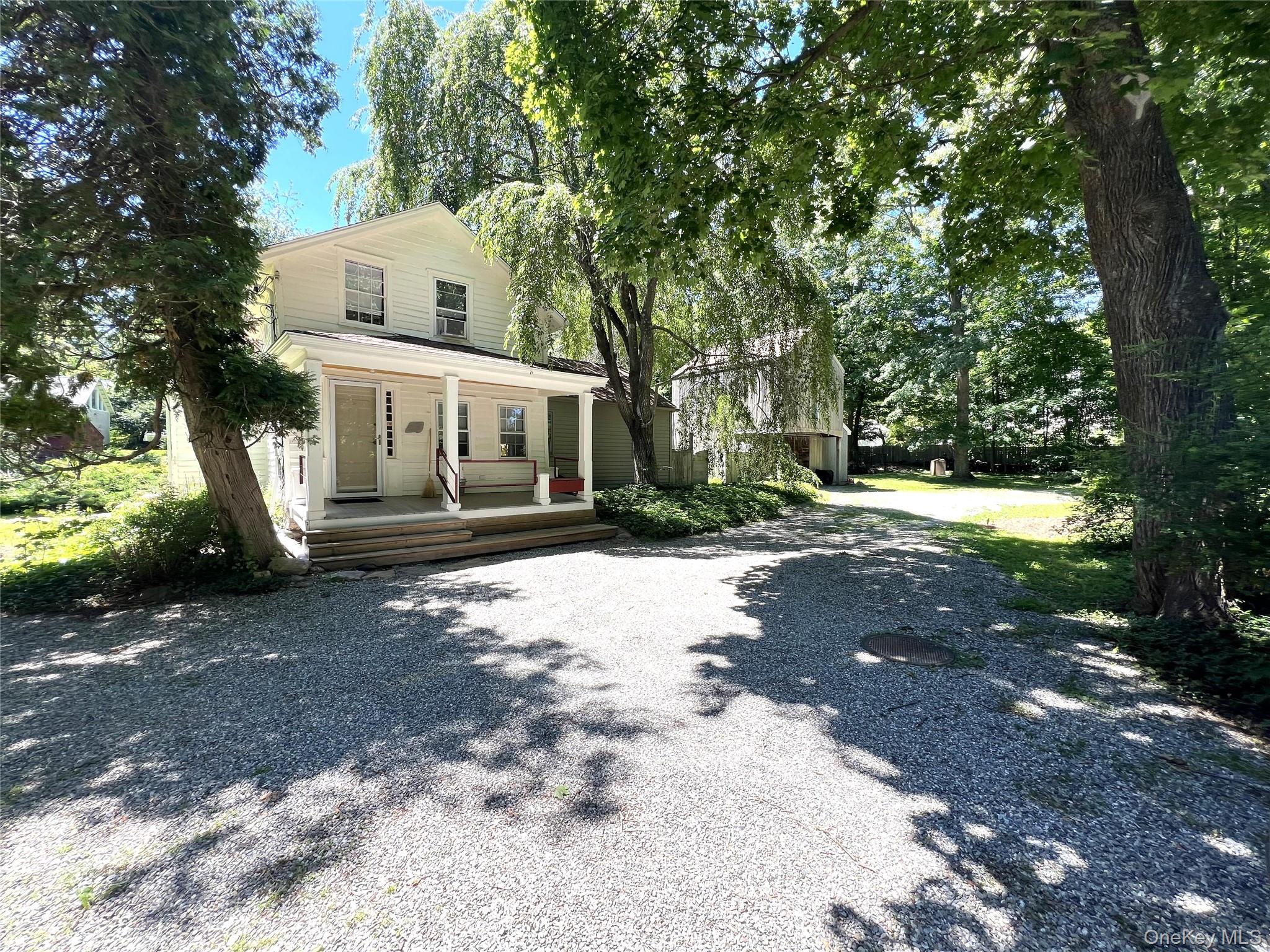 STEP INTO THE PAST. Part of South Salem’s rich history. Charming Antique Farmhouse, circa 1775, once a general store and post office. Rocking Chair Porch. Original Front Parlor. Country Kitchen. Warm and inviting Living Room with vaulted ceiling and doors to rear deck. Two Bedrooms and Two Baths. Separate Barn with garage bay and second floor heated Studio with vaulted ceiling. Picture book one-acre setting with old stone walls and mature trees. Conveniently situated with easy access to the shops and restaurants of Ridgefield and New Canaan, the Metro-North train and commuting arteries.