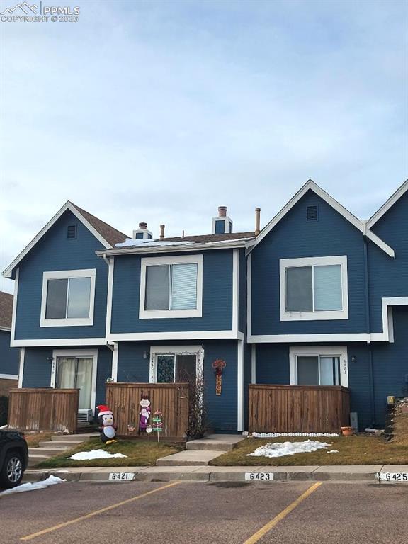 Wonderful end unit condo with mountain views! This 2 bedroom, 2.5 bath home features new paint throughout, new LVP flooring, and new carpet. The open main level offers a cozy wood burning fireplace in the living room, a kitchen with ample storage and dining space, and a walk out to the back patio with direct access to the assigned parking.  A convenient half bath and laundry are also located on the main level. Upstairs, you’ll find two large bedrooms, each with en-suite bathrooms for added privacy. This home is located in the heart of the city and is just a short walk to trails, parks and Sprouts Market. Enjoy a convenient location close to major shopping, restaurants, Academy Blvd and I-25!