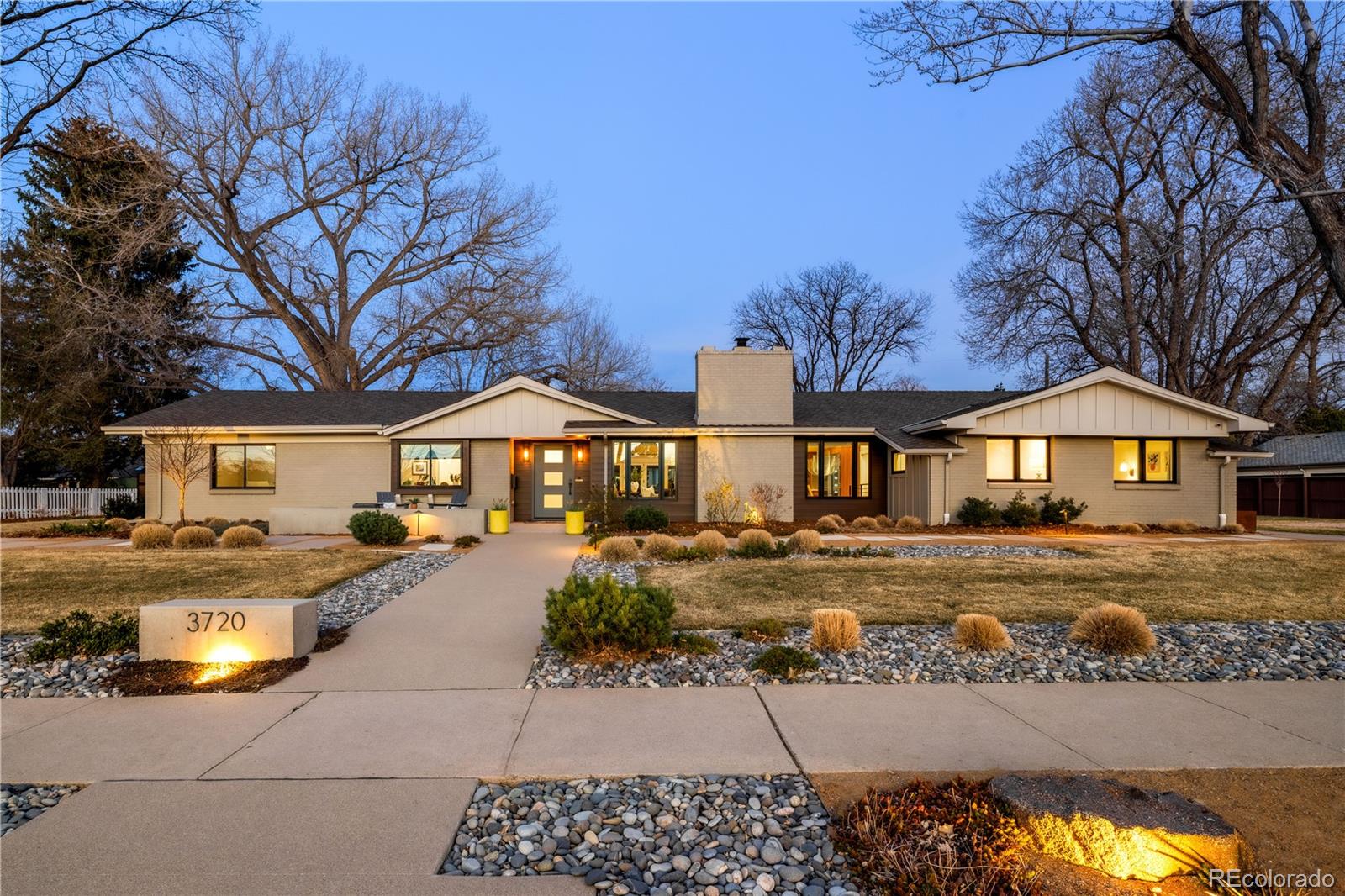 Thoughtfully curated, five bedroom/six bathroom masterful renovation. Two additional dens serve as convenient home offices. Vaulted ceiling great room with mountain views and custom floor-to-ceiling stone fireplace. With imported Moroccan Zellige tile, Ann Sacks and Delta selections, you will find no detail overlooked. Spacious main floor living and three zones for household members or guests, including four heated floor en suites. Professional chef-designed kitchen with custom walnut cabinetry, pass through pantry with Elkay water dispenser, Thermador 60" Range, True Side by Side Refrigerator/Freezer, Vent-A-Hood and dual Asko dishwashers. Plenty of storage on three sides of the white quartz island. Stunning custom wet bar, complete with full size True wine refrigerator, integrated beverage center and Sub Zero ice machine. Perfect indoor-outdoor connection via Sierra Pacific accordion doors, which open onto the half-acre lot. Design aficionados will appreciate this zen oasis, complete with luxury hardscape, xeriscaping and modern Infinity Euro panel fencing with Ameristar black steel frame (over 300K in exterior additions.) Elevated entertaining abounds with whole-house sound system which features high-end REL, Vienna Acoustics and BluSound speakers with BluSound amps, motorized louvered pergola, patio heaters, fire-pit, outdoor television, and low maintenance artificial turf.  All televisions, sound bars and sound system are included. Massive ~1,000 square foot 3-car heated garage reaching 17 feet in height, custom cabinetry and room for year round hobbies. Modern efficiency with 26 owned Silfab 400-watt solar panels (10.4 kW system), a new Bryant 800SA high-efficiency heat pump (approx. 60% utility savings), full security system, Cat 6 wiring, Level exterior locks, epoxy garage floors, Chargepoint EV station, and even a dedicated dog wash—this is easy living in one of Denver’s most sought-after enclaves. Moments from Kent Denver School & St. Mary’s Academy.