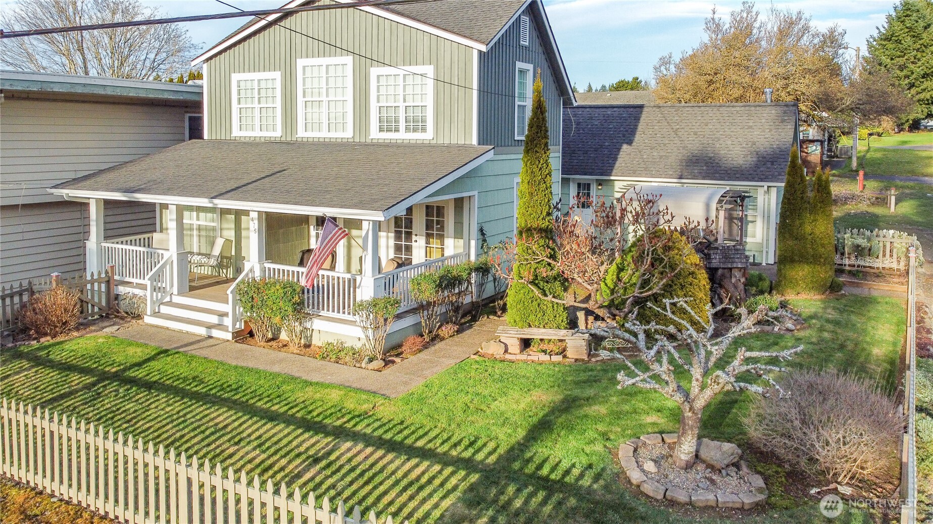 Step into timeless charm with this beautifully preserved 1920s home, thoughtfully expanded while honoring its original character. Quality craftsmanship shines throughout the 1,800 sq ft layout, offering warm, inviting spaces designed for both entertaining and everyday comfort. Many rooms capture beautiful Columbia River views, which can also be enjoyed from the deck. The kitchen features granite countertops and newer appliances, blending classic style with modern function. Two private primary suites, one on each floor, provide exceptional flexibility. The upstairs suite is airy, bright, and filled with natural light, creating a peaceful private retreat. Previously used as a partial short-term rental, guests enjoyed the front sitting room (which could be turned into and additional bedroom) and the entire upstairs suite, separated by privacy doors, blinds, and curtains. Sound-absorbing panels on the downstairs primary bedroom door enhance privacy. Outside, the fully fenced yard is meticulously maintained with blueberries, a plum tree, gazebo, and a secluded back patio with greenhouse that's perfect for potting and garden starts. Recent upgrades include new siding and exterior paint, new deck railing, new fencing, fresh interior paint in much of the home, most appliances and hot water heater recently replaced, ductless mini-splits for efficient heating and cooling, and whole-home surge protection. Character, views, and opportunity all in one.