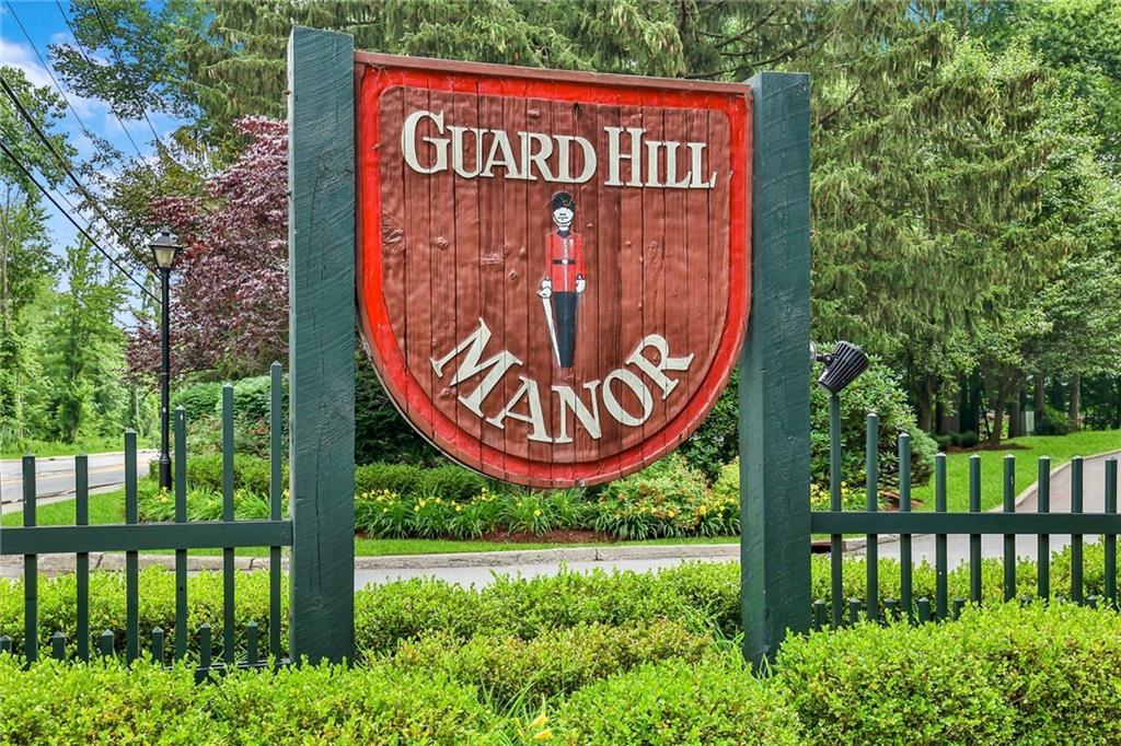 Welcome to this beautifully updated 2-bedroom, 2.1-bath corner unit in the highly sought-after Guard Hill Manor community in Mount Kisco! This bright and spacious townhouse features hardwood floors throughout and an open layout that’s perfect for modern living.

The updated kitchen offers white cabinets, stone countertops, stainless steel appliances, and a large island with seating, flowing seamlessly into the dining area. The living room is filled with natural light from oversized sliding glass doors and a transom window, and includes a cozy fireplace—with easy access to a private backyard patio.

Upstairs, the primary suite includes a walk-in closet and a stylish en-suite bath with a tub/shower combo. A second spacious bedroom also features its own updated en-suite bath with an oversized shower.

The finished lower level is ideal for a home office, gym, or playroom, and offers direct access to the attached one-car garage.

Enjoy all that Guard Hill Manor has to offer: pool, tennis courts, basketball court, playground, and plenty of guest parking.  Minutes to Metro North Train Station, shops, schools and main roads.   Move right in and start enjoying easy, low-maintenance living!