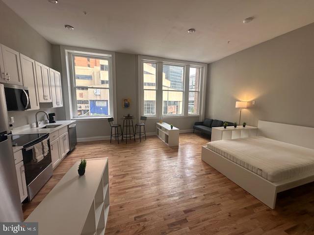 Welcome home to brand new 100 W. Lexington Street! You will love this bright and airy studio apartment in the heart of downtown. The location is ideal as its walking distance to the central business district, restaurants and shopping, MT Vernon, the Charles street corridor, a short bike ride to the University of Baltimore and the University of Maryland, and more. There are various units with sweeping views of the skyscrapers of the central business district and expansive views down liberty street towards the new CFG Arena. The building features high ceilings and lots of light, Stainless steel appliances, quartz countertops, all in one washer dryers, central AC, beautiful lighting, tile bathrooms, hardwood floors and more. The building was completely renovated with all new plumbing, electric, HVAC, sprinklers, elevator and more. Furnished apartments and parking available for an additional cost.