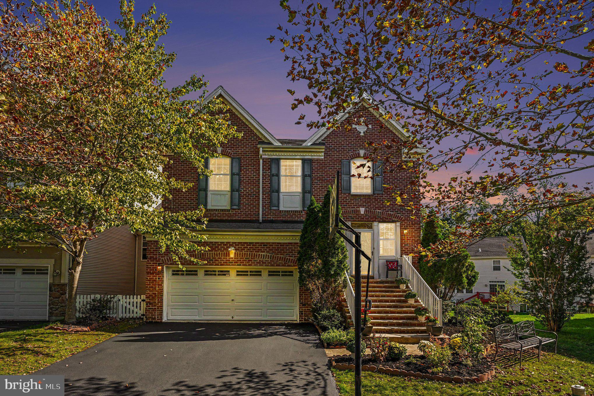 Welcome home to 328 Dartmouth Rd, a beautifully maintained and upgraded home located in the Byers Station Community which offers an incredible array of amenities from walking trails, pools and tennis to sports courts tot lots and a clubhouse!  This home has lovely curb appeal with brick, vinyl siding, a newly installed roof (July 2026) and spacious 2 car garage with opener and interior access.  A full view storm door and transom window provide plenty of light to the foyer with two coat closets and gorgeous cherry hardwood floors that continue throughout the main level.  This open floor plan is ideal for entertaining and living. From the foyer, enter into a lovely formal receiving room with crown molding and half walls with columns defining the space.  Light and bright and truly maintained.  Beyond is a dramatic dining room with 2 story ceilings sporting a wall of windows, chandelier and chair rail.  The chef will be ecstatic with the spacious well appointed kitchen featuring 42" raised panel cabinetry with crown molding, granite counters, a brand new subway tile backsplash, a lazy susan and new island with breakfast bar, additional storage and shelving. There is recessed lighting, a walk-in pantry, and an oversized undermount stainless steel sink with disposal and gooseneck faucet situated under a window overlooking the deck and rear yard. ALL stainless steel newer appliances - KitchenAid dishwasher, 5 burner GE Profile gas range, Pacific vented hood and a GE Profile French door refrigerator with ice and water dispenser.  A breakfast nook with double sliding doors opening to the composite newer deck (2023) accessing the backyard and what a perfect spot for your morning coffee.  Half walls with columns create an opening to a large family room with a triple window, ceiling fan, built-in bookcases and lovely gas fireplace with marble surround, hearth and wood mantle.  Look at the adorable barn door to the main floor suite.  The main level has a bedroom suite with a double closet that could be used as an office or in-law suite and has an adjacent FULL bath with tile floors and tub with tiled shower surround.  Notice the beautiful hardwood stairs as you continue to the upper level with four bedrooms and 2 MORE full baths with hardwood floors, crown molding and a large linen closet in the hallway. The primary suite is a true retreat!  The bedroom has a trey ceiling, Berber carpet, ceiling fan, plenty of windows, a double and a walk-in closet, while the primary bath has a separate water closet, tile floors, tiled stall shower with new rain shower-head, linen closet, double sinks with new lighting, and a corner soaking tub with tiled surround.  The additional three bedrooms have Berber carpet, double closets, and ceiling fans and share a full hall bath with tiled floors and stall shower with tiled surround.  You will love the convenience of an upper level laundry room complete with utility sink, built-in cabinetry and LG washer and dryer included!  Even more living space has been created in the finished basement.  This is another amazing feature of this incredible home.  This expansive space features easy care luxury vinyl plank floors, a wall of windows (including an egress), recessed lighting, built-in bookcases, electric fireplace and the owners are also including the home theatre with projector, surround sound and screen.  There is also incredible storage with a utility room, storage closet and yet ANOTHER bath with tiled floor and tiled stall shower.  So much has been done to make this home ready for you - fresh paint, NEW Bradford White hot water heater, Armstrong AC/Heater (2023) with zones/programmable thermostat AND a One Year AHS Home Warranty.  The sellers have left no stone unturned.  Freshly coated driveway just this past week.  The community offers so much in addition to easy access to commuting, shopping, dining and entertainment.  Hurry to make this wonderful home yours!