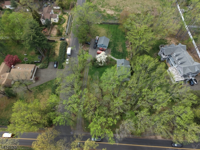 Welcome to 1461 Cooper Road in Scotch Plains. This expansive property offers over 38,768 sq ft of land, providing a rare opportunity to build your dream home or enjoy the existing residence. The current home features 3 bedrooms, 1 bathroom, a recently renovated bath, and an unfinished basement with plenty of potential. Whether you're looking to develop or move right in, this property offers flexibility and value in a highly desirable location. Please DO NOT walk the property without an appointment.