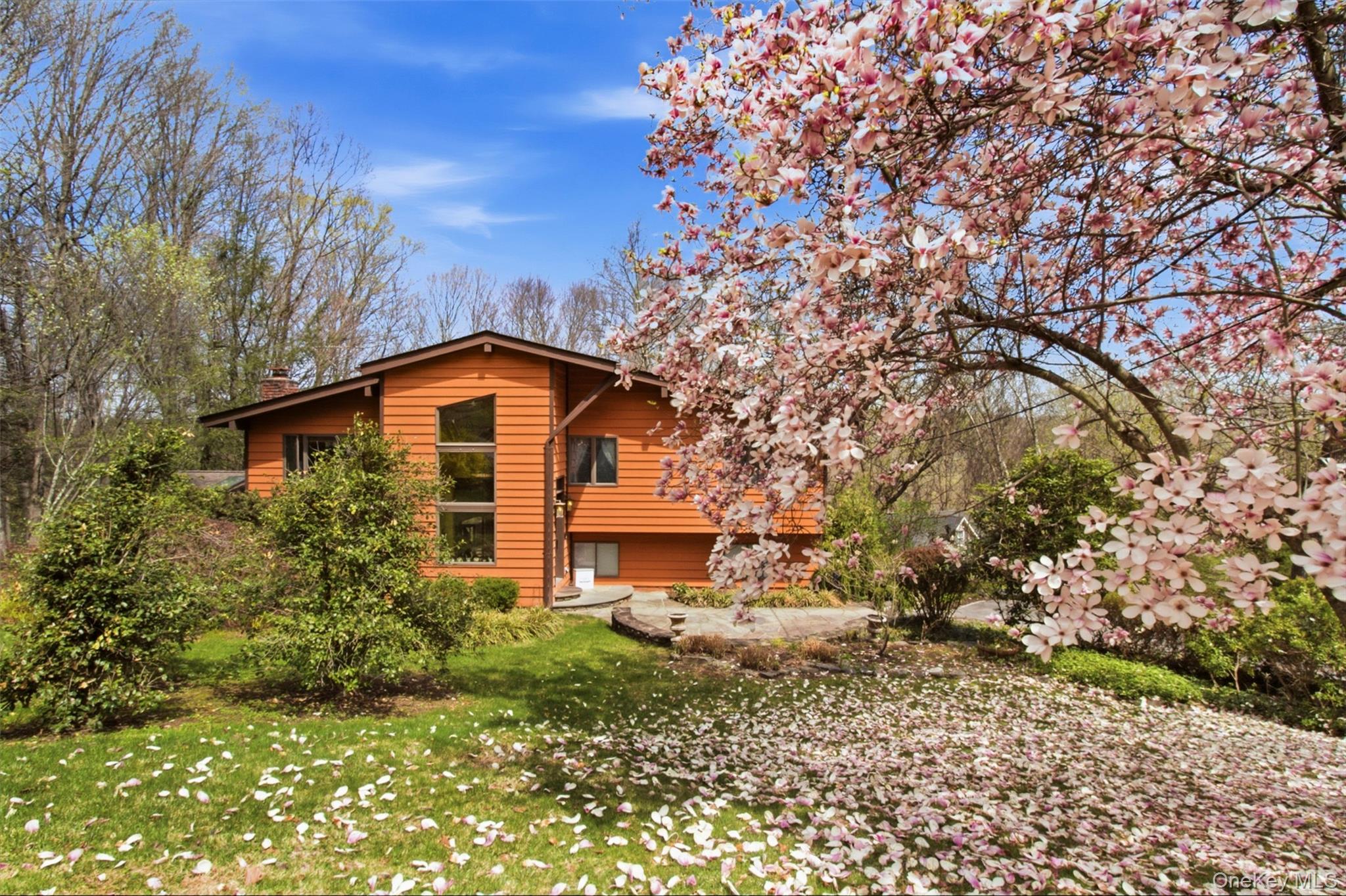 Welcome to this beautifully maintained raised ranch in the desirable town of Somers! 67 Entrance Way in Purdys, NY, offers the perfect blend of comfort, functionality, and outdoor enjoyment. This spacious home features 4 bedrooms and 2 full baths, highlighted by vaulted ceilings, skylights, and a combination of ceramic and wood floors that create a bright, open feel throughout the main living area. The expanded foyer provides a warm and inviting entrance, while the private, sunlit office offers an ideal space for working from home or a quiet retreat. The lower level features a walk-out basement that leads directly to a patio, perfect for seamless indoor-outdoor living. Step outside and enjoy the thoughtfully landscaped property, complete with mature shrubs, perennials, a deck, and a patio, ideal for entertaining or relaxing. Garden enthusiasts will appreciate the irrigated, fenced-in 20x40 vegetable garden, so get ready for your fresh veggies.  Additional highlights include a one-car attached garage with driveway parking and a convenient location just minutes to shopping, restaurants, the train, and Interstate 684, making commuting a breeze. A wonderful opportunity to enjoy space, privacy, and convenience all in one exceptional home!