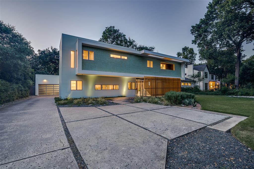 Featured in D MAGAZINE, as one of Dallas’ most beautiful homes, this really is sophisticated Modern Living.  Set in “Big” Forest Hills, just steps from White Rock Lake and framed by towering mature trees, this estate like home has exceptional curb appeal.  Offering 4-bedroom, 4-bath contemporary residence is an architectural masterpiece set on a lush 0.60-acre lot in coveted Forest Hills. Originally designed by an architect as their personal retreat, the home blends sleek modern design with timeless comfort, offering a rare combination of luxury and livability in East Dallas. Inside, rich hardwood floors flow throughout open living spaces with soaring ceilings and floor-to-ceiling windows that fill the home with natural light and provide serene views of mature trees and beautifully landscaped grounds. Multiple balconies and a breezeway create seamless indoor-outdoor living, while the sparkling swimming pool serves as a private retreat for relaxation or entertaining. An oversized two-car garage offers both functionality and convenience. Located just a short stroll from White Rock Lake and the Dallas Arboretum, this home offers direct access to the city’s best outdoor recreation and cultural experiences, all within one of Dallas’ most sought-after neighborhoods. This is truly a Forest Hills gem where modern sophistication meets everyday comfort.