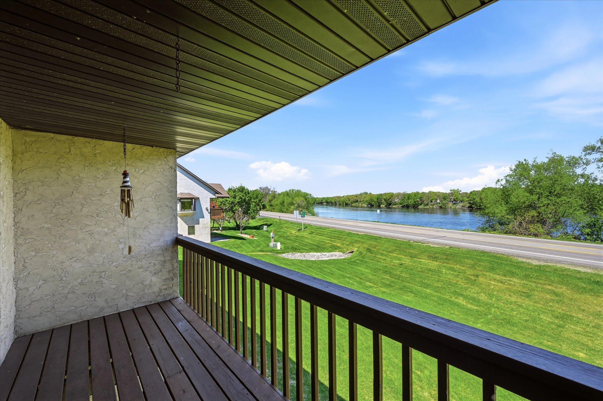 Mississippi River views, effortless one-level living, and a location close to everything you love, welcome home! This inviting townhome offers an open, comfortable main level designed for easy everyday living and relaxed entertaining. The primary bedroom features a walk through bath with a convenient step-in shower, while the walkout lower level provides wonderful flexibility for your needs. An unfinished area in the lower level is ready to become your dream workshop, hobby space, storage area, or future finished living space. Step outside and enjoy the beauty of the river, then head out for shopping, dining, and entertainment just minutes away. A special opportunity to enjoy comfort, convenience, and beautiful surroundings all in one place.