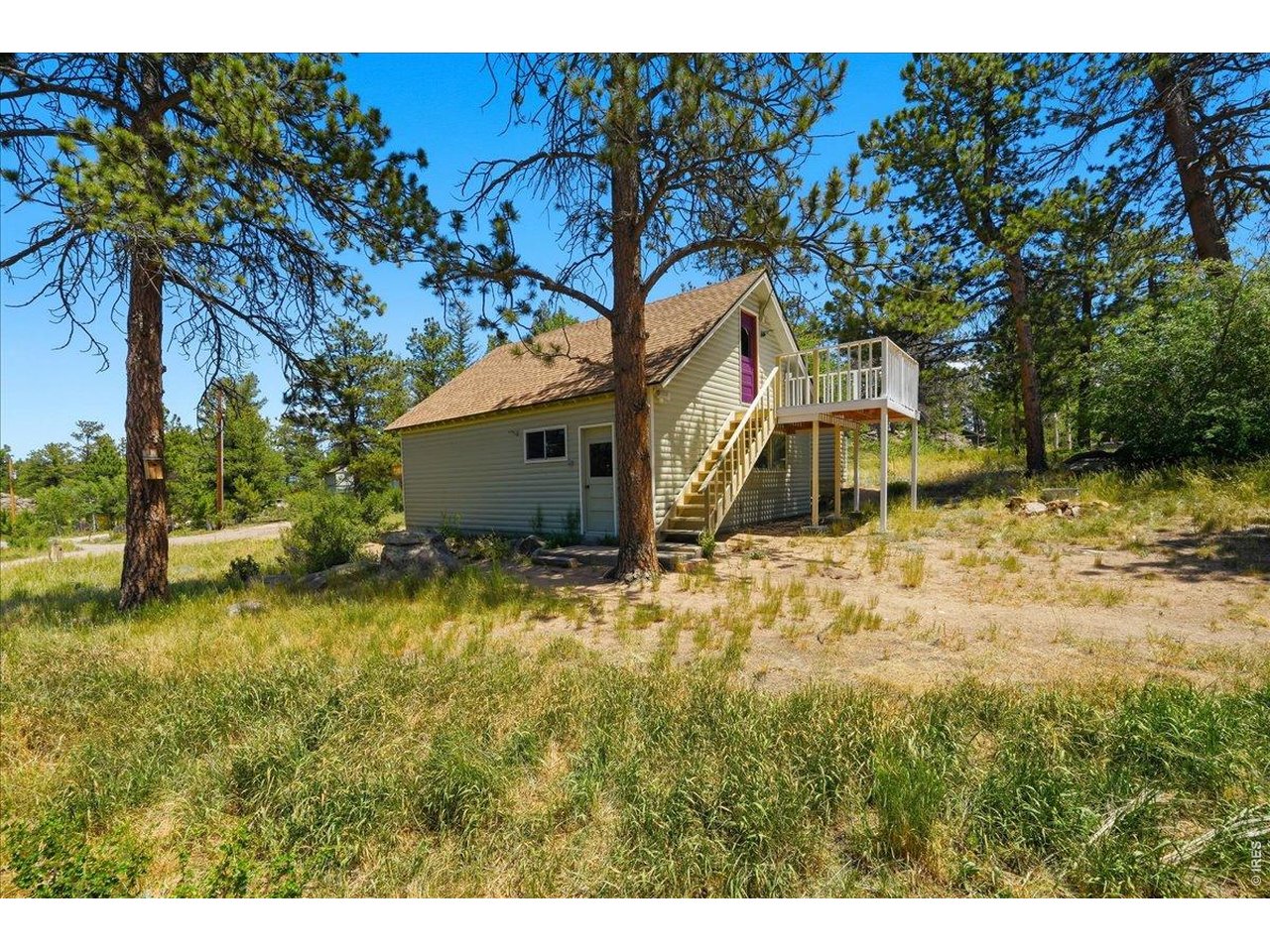 MOTIVATED SELLERS, moving out of state and want house SOLD!! Nestled in the scenic mountains of Northern Colorado, this inviting 2 bed/1 bath cabin offers the perfect blend of rustic charm and modern convenience, making it an ideal getaway or comfortable year-round residence, depending on your preference. The home is situated just steps from Shagwa Lake, one of eight exclusive private lakes in Red Feather Lakes, and comes with a private membership that grants you access those. In addition to the main cabin, the property features a spacious detached garage with a 630 sq ft versatile hangout area above, perfect for relaxing or entertaining guests. The house offers a 562 sq ft deck, ideal for summer BBQs and outdoor gatherings, as well as wood floors, a beautiful brick fireplace, and wood cabinets, ensuring a warm and inviting atmosphere throughout. All the essential amenities are included, so you can settle in with ease and enjoy the mountain lifestyle. To further enhance your privacy and space, two additional lots accompany the main house lot, offering a total of 1.72 acres. Whether you're seeking a peaceful escape or a full-time home surrounded by natural beauty, this property is ready to welcome you. Property has a private well and full septic with leach field.