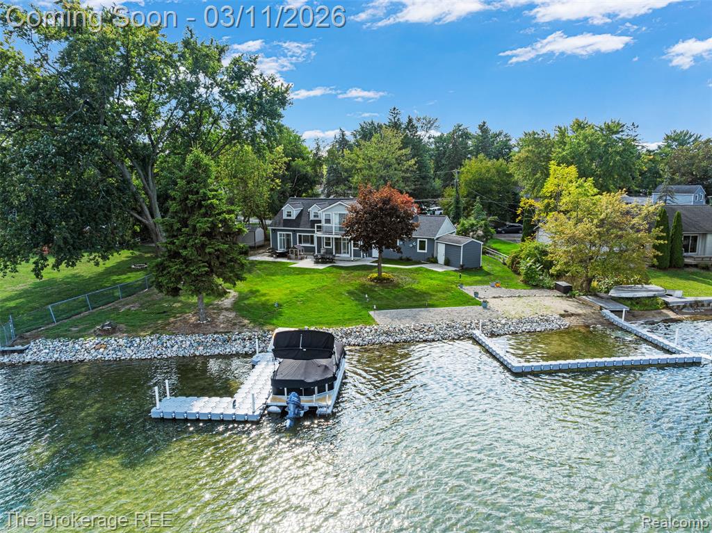 Luxury Lakefront Living on private, all sports Crescent Lake. Welcome to this stunning 4-bedroom, 2.5-bath lakefront home offering 138 feet of pristine frontage on all-sports Crescent Lake. Completely remodeled in 2023—with even more upgrades completed since—this turn-key retreat is ready for you to arrive and immediately enjoy the best of lake living.The open-concept main level is filled with natural light from a dramatic wall of windows showcasing breathtaking lake views. Stylish LVP flooring flows throughout, leading to a beautifully designed chef’s kitchen featuring expansive granite countertops, new cabinetry, and stainless-steel appliances—all included. Additional highlights include a convenient first-floor laundry, plush new carpet in every bedroom, custom wood blinds throughout (2023), and a fully renovated main-floor primary suite with a spa-inspired bathroom.Recent upgrades provide peace of mind and modern convenience, including a new roof (2024), crawl space encapsulation (2023), whole-house generator (2024), new garage door and opener (2024), brand-new washer and dryer, added insulation, upgraded water filtration and softener system, new concrete driveway, new entry doors, updated electrical, and new lighting and ceiling fans throughout.The exterior is equally impressive with a sandy beach area, professional landscaping, newer concrete patio (2023), Trex balcony deck (2022), New rock seawall (2023), and a large shed/boathouse for additional storage. A second driveway offers abundant parking and convenient space for an RV or boat.With extensive upgrades, luxury finishes, and exceptional lake frontage, this property delivers the ultimate lakefront lifestyle. Schedule your private showing today and experience Crescent Lake living at its finest.