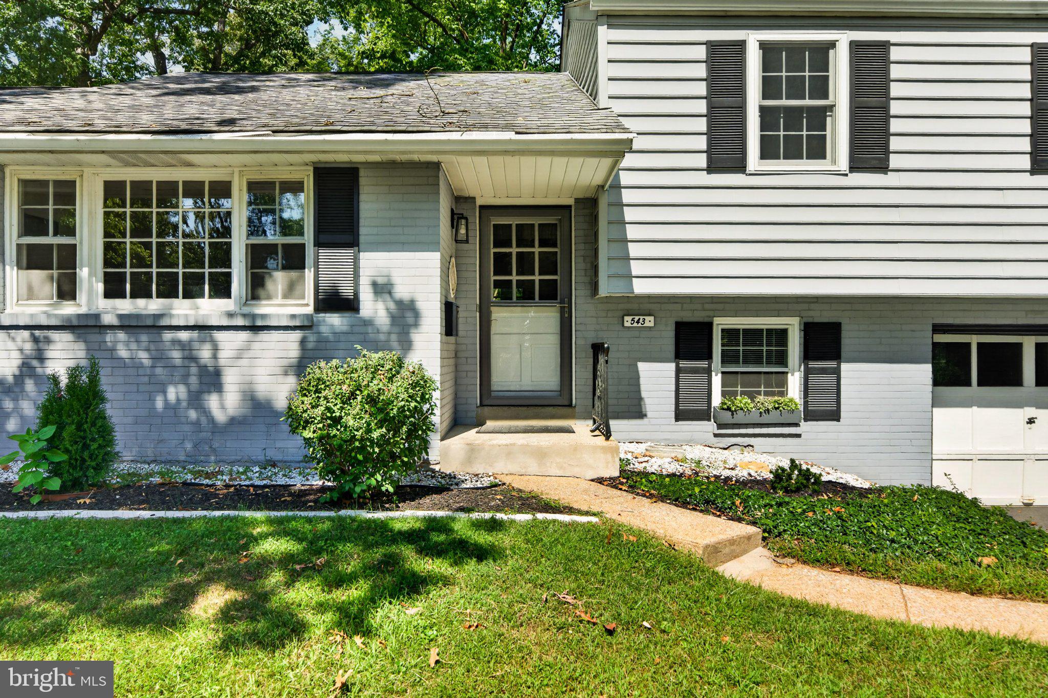 ***Offer deadline 9/21/2026 @2.00PM***  Welcome to 543 Midland Avenue, an expanded four-bedroom Main Line split-level in Berwyn Downs, within the Tredyffrin/Easttown School District. Enjoy convenient access to Berwyn’s shops and restaurants, regional rail, the library, and nearby parks. Inside, the foyer opens to bright, connected living and dining areas with hardwood floors and built-in storage—an inviting setting for everyday routines, shared meals, and entertaining. Glass French doors lead to a spacious study with additional built-ins and an adjacent storage room, offering flexibility for a home office, homework zone, play space, or creative studio. The family room features a vaulted ceiling, exposed beams, and a large picture window looking out onto the backyard. Refreshed in 2026, the kitchen features quartz countertops, white cabinetry, stainless steel appliances, gas cooking, recessed lighting, a garden-window nook, and a breakfast bar. Three bedrooms and a refreshed hall bath are located on the second level, while a fourth bedroom on the third level offers access to a walk-up attic. The walk-out lower level provides a versatile bonus space, powder room, laundry area, and direct access to the one-car garage. Outside, the level backyard offers room for play, gardening, and relaxed weekends at home, while a two-car driveway provides additional parking. Schedule your preview today!