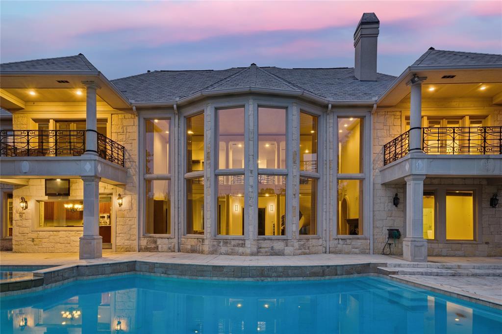 A rare opportunity in one of Las Colinas' most prestigious gated communities, positioned directly on the fairways of The Nelson Golf & Sports Club at Ritz-Carlton Las Colinas.This expansive residence delivers the best of resort-style living with every detail designed for both grand entertaining and everyday comfort. A dramatic two-story foyer with sweeping staircase sets the tone, opening to formal living and dining rooms framed by cast-stone columns and rich custom millwork. The gourmet kitchen flows into a light-filled family room with panoramic views of the manicured greens.Two primary suites—one on each level—offer flexibility for multigenerational living or guest privacy. The upstairs retreat includes a private gym and spa-inspired bath. Three additional bedrooms, a dedicated home office, media room, and oversized game room with covered balcony complete the layout.Step outside to your own backyard oasis: sparkling pool, spa, and covered patio with uninterrupted golf course views—ideal for morning coffee or sunset cocktails. A 4-car garage accommodates vehicles, golf carts, and all the extras.Scale, privacy, and a front-row seat to the Nelson golf experience. This is Las Colinas living at its finest.