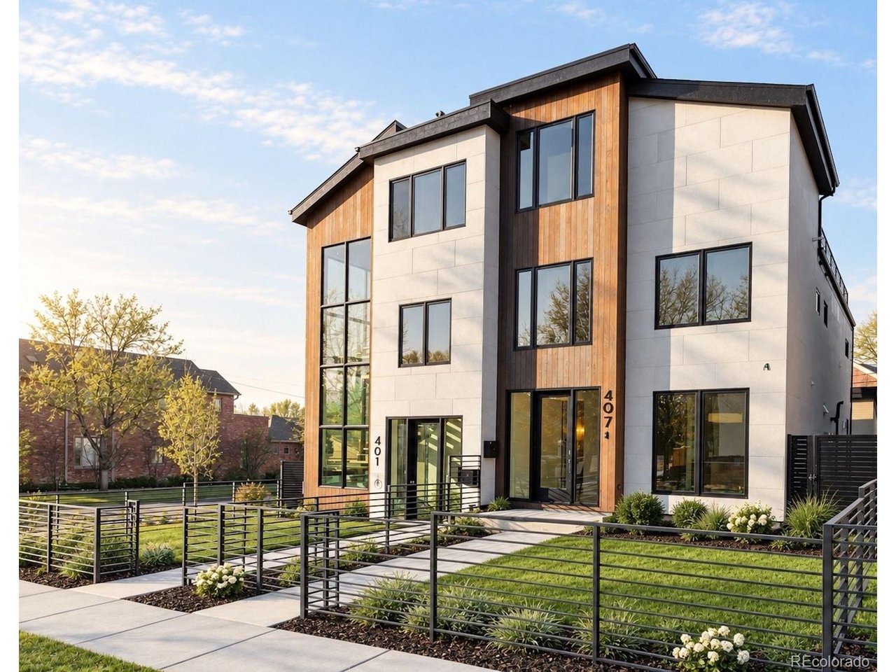 Designed for the discerning, this newly constructed residence at 407 Madison Street pairs architectural sophistication with thoughtful, modern luxury in the heart of Cherry Creek. Built by MAG Builders and spanning nearly 3,800 square feet across four levels with a private elevator, every inch of this home reflects a commitment to high design, comfort, and lifestyle. The main level is anchored by an open-concept floor plan and wide-plank white oak floors, featuring a gas fireplace and seamless flow to the private patio and detached 2-car garage. The chef's kitchen is a standout, outfitted with Sub-Zero, Wolf, and Asko appliances, Calacatta Cemento quartz countertops, a waterfall-edge island, Carrara tile backsplash, and designer cabinetry. Adjacent, the formal dining space is enhanced by a striking built-in wine storage wall that adds both form and function. Upstairs, the primary suite offers a spa-inspired retreat complete with a steam shower, heated marble floors, a freestanding soaking tub, and a custom walk-in closet. A secondary en-suite bedroom, laundry with utility sink, and ample storage round out the second floor. The top level features a bonus room with a wet bar, 3/4 bath, and direct access to a spacious rooftop terrace engineered for a hot tub, the ultimate setting for sunset cocktails and elevated entertaining. The lower level offers incredible versatility with a generous family room, full wet-bar, private guest suite, and extensive storage. All just moments away from Cherry Creek North's most distinguished offerings, where acclaimed dining at Le Bilboquet, Matsuhisa, and Quality Italian meets high-end fashion, curated boutiques, and renowned art galleries, all set against the backdrop of one of Denver's most vibrant and walkable neighborhoods.