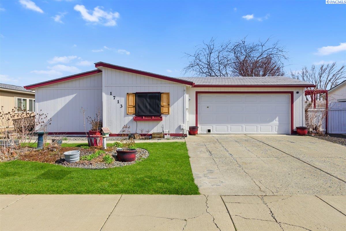MLS# 291534 Well-maintained 3 bed, 2 bath manufactured home on its own lot located in a desirable 55+ community featuring a pool, tennis courts, clubhouse, and optional RV parking (additional cost). Maintenance Association dues are very low at just $30/month, providing access to these great amenities.This home offers thoughtful updates to improve accessibility, including wider doorways, adjusted counter heights, and durable scratch-resistant flooring. Skylights in the kitchen and primary bathroom provide abundant natural light, creating a bright and inviting atmosphere. The kitchen features a minimalist design with pantry and open shelving, creating a clean and functional space.The bathrooms have been largely updated, with the primary bathroom offering an opportunity for the next owner to add their own finishing touches, including installation of a vanity.Additional features include a 2-car garage with a full workbench and cabinets, a newer outdoor heat pump, and a fully fenced backyard offering privacy and space to relax or entertain.Enjoy low-maintenance living in a well-established community with great amenities!