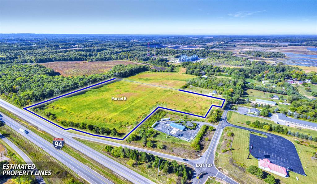Prime commercial opportunity with excellent visibility and access at Exit 127 off I-94. This 26.61-acre parcel is currently a corn field and benefits from qualified agricultural tax status. Zoned C-2 Commercial, the property features approximately 160 feet of frontage on N Concord Rd and 925 feet along I-94, making it ideal for a wide range of development possibilities. Located on the on-ramp, it offers exceptional traffic exposure and convenience. An additional 26 acres directly adjoining to the north is also available, providing extended frontage on Michigan Ave and even greater development potential. Current use is Agricultural.