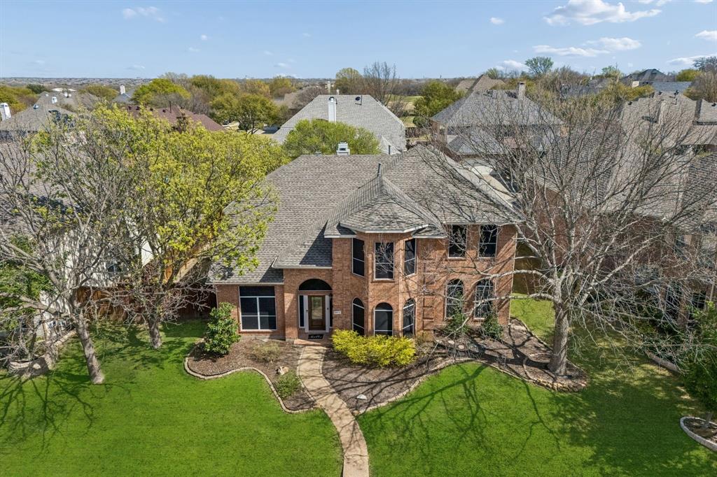 Stunning 4-bedroom 3-bath home in a sought-after gated Plano community featuring vaulted ceilings, abundant natural light, hardwood flooring, and a beautifully renovated primary bath. Offering approximately 3250 square feet on a spacious .22 acre lot, this home combines comfort, style, and exceptional community amenities. The open-concept layout is designed for both everyday living and entertaining. Large windows fill the home with natural light while the vaulted ceilings create an airy and inviting atmosphere. Rich hardwood flooring enhances the main living areas, adding warmth and timeless appeal. The spacious kitchen serves as the heart of the home features a large center island, breakfast bar, ample cabinetry, and extensive counter space-perfect for cooking and gathering. Built-in water purifier and reverse osmosis filtration system provides clean drinking water directly from the kitchen. The private primary suite offers a luxurious retreat with a newly renovated spa-inspired bathroom showcasing granite counter tops, marble flooring, glass tile accents, and a stunning natural stone walk-in shower. additional bedrooms provide flexibility for guest, family members, or a home office, while three full bathrooms ensure comfort and convenience for everyone. Recent improvements include a 2023 Class 4 impact resistant roof, offering added durability and potential insurance benefits. The property also features a two car garage and sits on a generously sized lot. Residents enjoy outstanding HOA amenities including community swimming pools, tennis courts, a fitness center, and a playground. Ideally located near restaurants, shopping, and entertainment, this home offers the perfect balance of lifestyle and location.