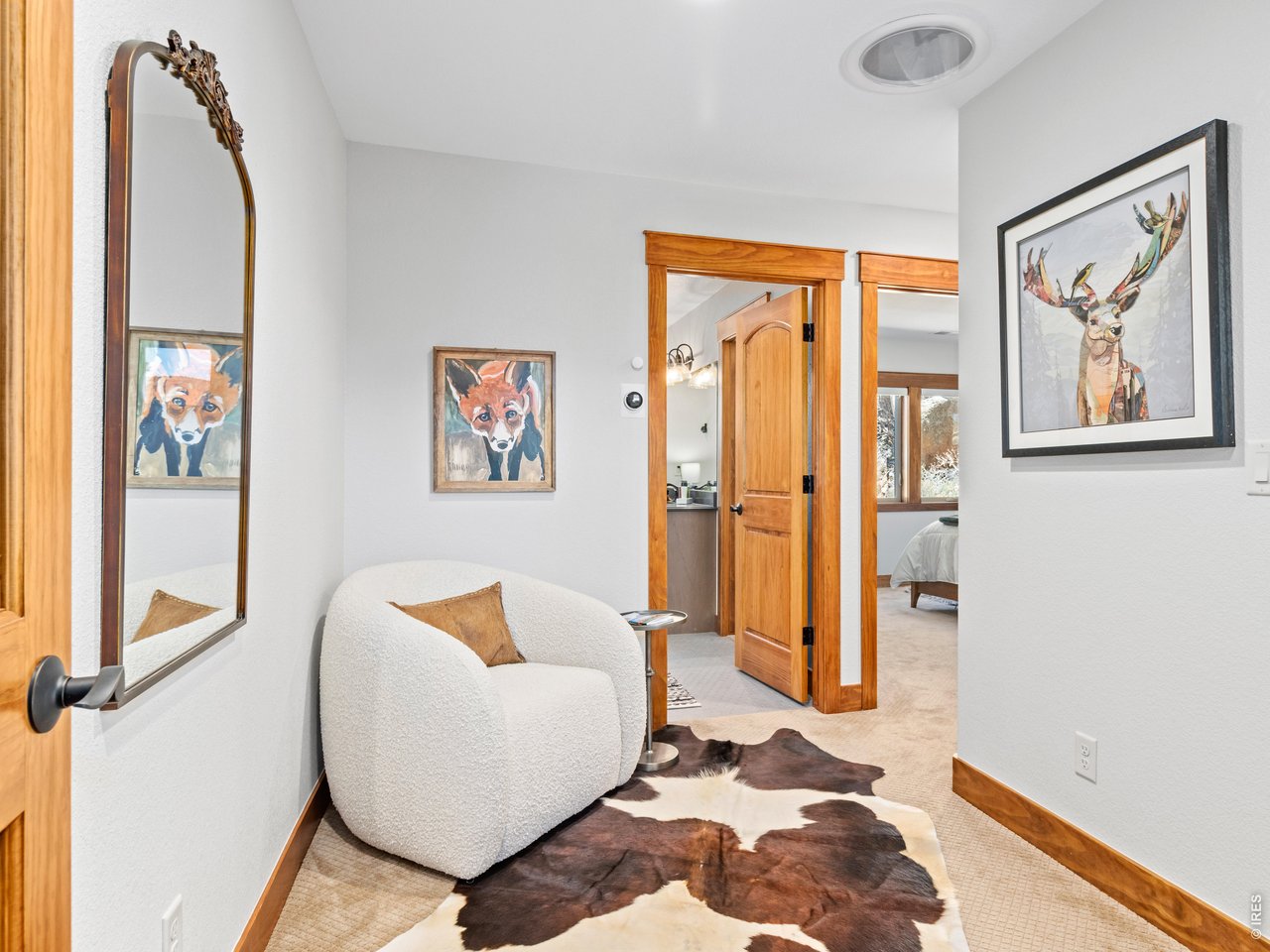 Enfolded in a hillside of big boulders & backing up to The Thumb Open Space, the stunning mountain home @ 225 Curry Dr is a true gem. Cross-Valley Views from Kruger Rock to Giant Track Mtn, w/ Twin Sisters the focal point & Twin Peaks - Longs & Meeker - crowning the scene, provide an ever-changing procession of light & shadows through the day. Located on the south slope of Prospect Mtn in the Prospect Highlands neighborhood, this beautiful, like-brand-new Estes Park home features luxurious, high-end finishes & a long list of new upgrades. Natural light floods into this beautifully crafted home, & there's truly breath-taking views from every window. Inside, the home feels both refined & comfortable, w/ a clean, modern aesthetic, open-concept living, & nice big kitchen w/ island & pantry. The main level primary suite is positioned for privacy & convenience, & there is an office, mudroom/laundry room and exercise area rounding out the downstairs. Upstairs are add'l BRs & flexible living space. Quality finishes & smart design choices are evident throughout, from the sunshine pouring in the wall of south-facing windows - keeping the home bright-lit all day and warm w/ solar gain in the winter, perfect for relaxation & rejuvenation - to the efficient layout, to the generous storage. Recent upgrades include Central A/C, Hunter Douglas Blinds, Deck Awning. Hiking Trails are nearby & you can walk out the door & loop through the Thumb Open Space for a fantastic workout and amazing views. Homer Rouse Trail & Lily Mountain are a short drive to additional dog-friendly trails and there's quick & easy access to downtown Estes & Rocky Mountain National Park. Outside the house, you're immersed in classic Estes Park terrain - big rock outcroppings, mature evergreens, and open skies - yet still within city limits with paved access & utilities. Whether you're looking for a full-time residence or a mountain getaway, this home delivers with newer construction, & truly exceptional views.