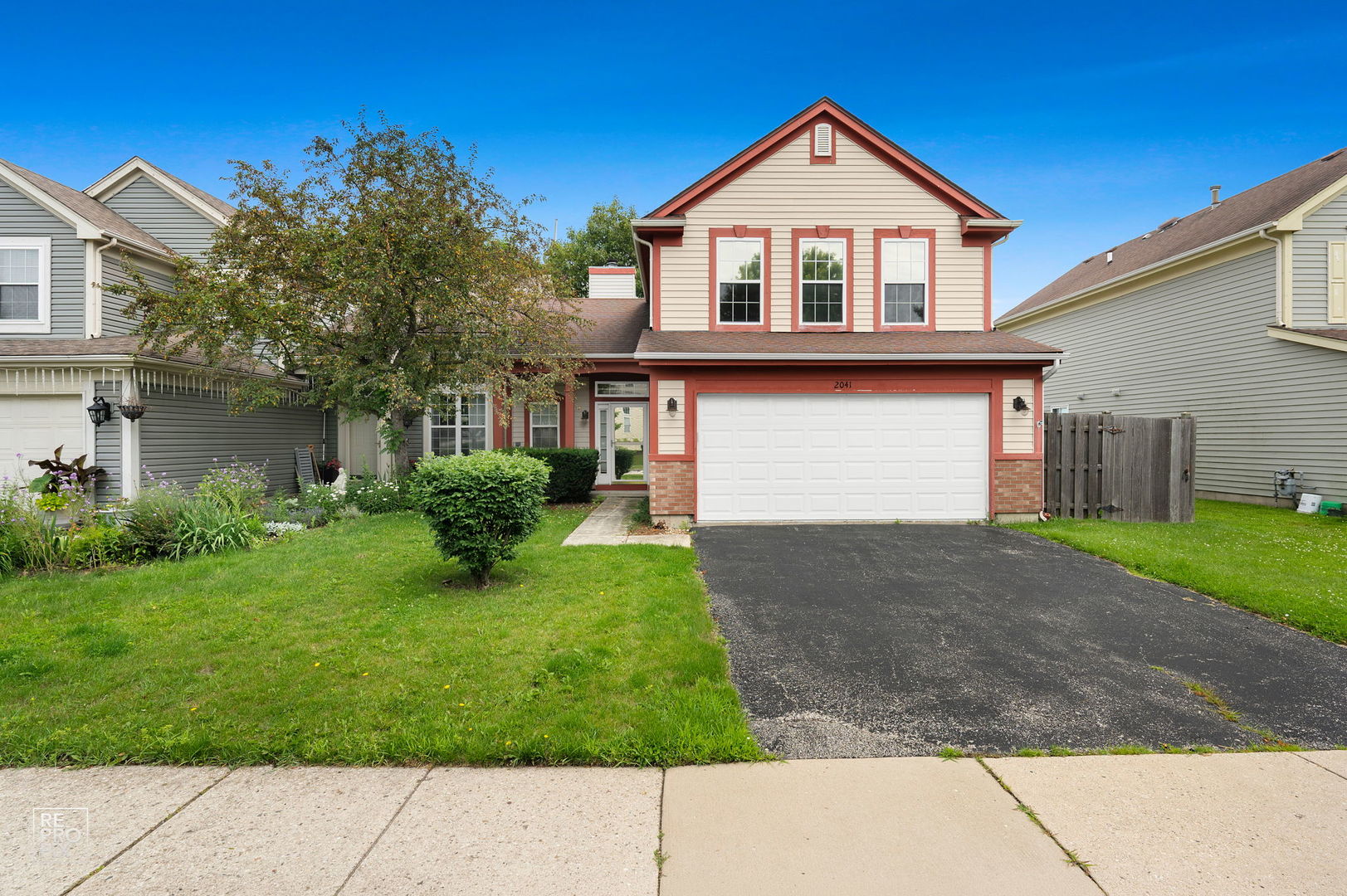 Welcome Home to Cambridge Country North!  Prepare to fall in love with this beautiful, sun-drenched 3 bedroom, 2.5 bathroom home!  This home is a great balance of low-maintenance living with the feel of a single-family home.  From the moment you step inside, the dramatic cathedral ceilings and vast windows create an airy, expansive atmosphere that greets you with warmth.  The heart of the home features an inviting living area complete with a cozy fireplace - perfect for chilly Illinois winters.  Flow seamlessly into the kitchen, fully equipped with sleek stainless-steel appliances, plenty of cabinet storage, and an effortless transition to your dining space.  Upstairs, the generous master suite serves as a true private retreat, boasting incredible natural light and an abundance of closet space.  Two additional spacious bedrooms are also located with a 2nd full bath.  Step outside to your own private oasis.  This home features a fully fenced-in yard, a sprawling concrete patio ideal for summer barbecues, and a matching storage shed.  The two-car attached garage is fully insulated and customized for easy set up of a workshop and storage.  Located just minutes from excellent Fremont and Mundelein schools, Asbury Park, Walking Trail, Barefoot Bay, Mundelein Park District, Fremont Public Library and much more - all within walking distance! This turnkey gem is ready for its next chapter!