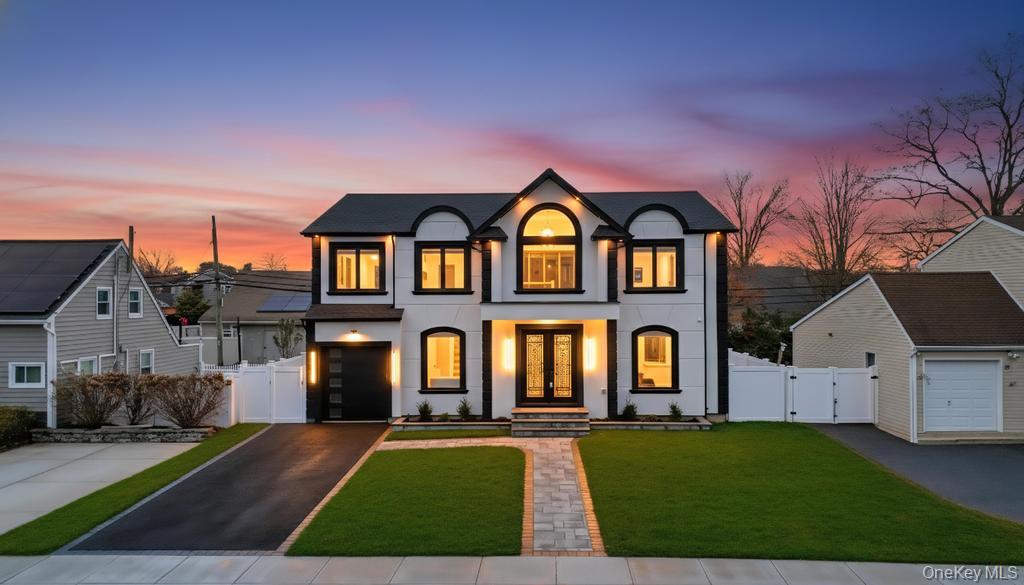 Introducing a Magnificent Stucco facing 5-bedroom, 6-bath Colonial offering over 5200 sq. ft. of meticulously designed living space with Propane Heat and Gas Cooking. This architectural gem features four luxurious bedroom suites, a fully finished 1600 sq. ft. basement with a private side entrance and full bath—ideal for entertaining, extended living, or flexible use. Step through the grand double-door entry into a dramatic two-story foyer that sets the tone for the home’s sophisticated design. The open-concept layout boasts coffered ceilings, rich hardwood floors, custom millwork, and an abundance of natural light throughout. The gourmet kitchen is a showstopper, featuring custom cabinetry, premium appliances, and elegant designer finishes. Every element of this home has been crafted with exceptional attention to detail—from the spacious living and dining areas to the thoughtfully designed bathrooms and high-end materials throughout. The exterior impresses with striking curb appeal, including architectural pillars, premium Pella windows, and that reflects modern luxury. Located in a prime neighborhood, don’t miss this rare opportunity.