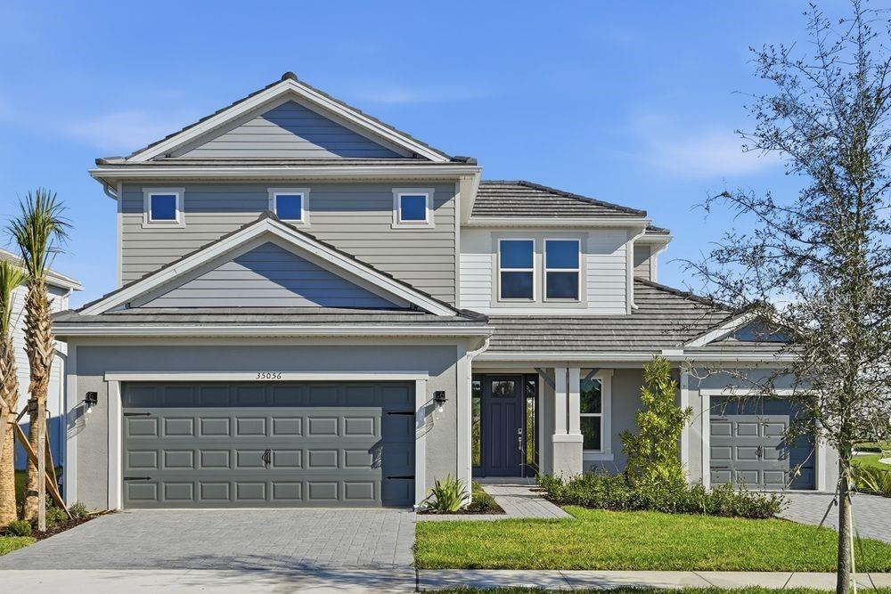 What's Special: Corner Lot | 1st Floor Guest Suite | Covered Extended Lanai | Gourmet Kitchen | Pond View. New Construction - Ready Now! Built by Taylor Morrison, America's Most Trusted Homebuilder. Welcome to the Tortola at 35056 Emberview Drive in Hammock at Two Rivers. This stunning new home makes a bold first impression with its soaring two-story foyer. Just off the entry, you’ll find a half bath, laundry room, and a private secondary bedroom with its own en-suite, perfect for guests. At the heart of the home, the open-concept gathering room features oversized sliding glass doors that lead to a sunny lanai, creating the ultimate indoor-outdoor living experience. The spacious gourmet kitchen overlooks this area and includes an elongated island with a stainless steel apron-front sink, stylish pendant lights, a walk-in pantry, and plenty of counter space for meal prep. A cozy dining area completes the space. The main-level primary suite offers a spa-like bath and a generous walk-in closet for your retreat. Upstairs, you’ll find three secondary bedrooms, one with a private en-suite, another full bath, and a large game room for fun and relaxation. Step into Hammock at Two Rivers—a resort-style private social club designed for elevated living. This planned, member-only haven will feature a premier health club, racquet sports, spectacular pool, and more. Savor a meal with neighbors at the planned fine dining restaurant or enjoy a staycation at the poolside bar. Other planned amenities include a playground, lap pool, event lawn, and a slide tower for endless fun. Beyond the community, Zephyrhills offers small-town charm with easy access to Tampa and Orlando. Explore local dining and shopping, cheer on major sporting events, or spend the day at nearby theme parks and beautiful beaches like Sunset Beach and Clearwater Beach. There’s so much to discover! Additional Highlights Include: Gourmet kitchen, pocket slider at great room, extended lanai, bar in great room, 8' interior doors, door at game room, and tray ceiling at great room, primary suite, and foyer. MLS#TB8457119