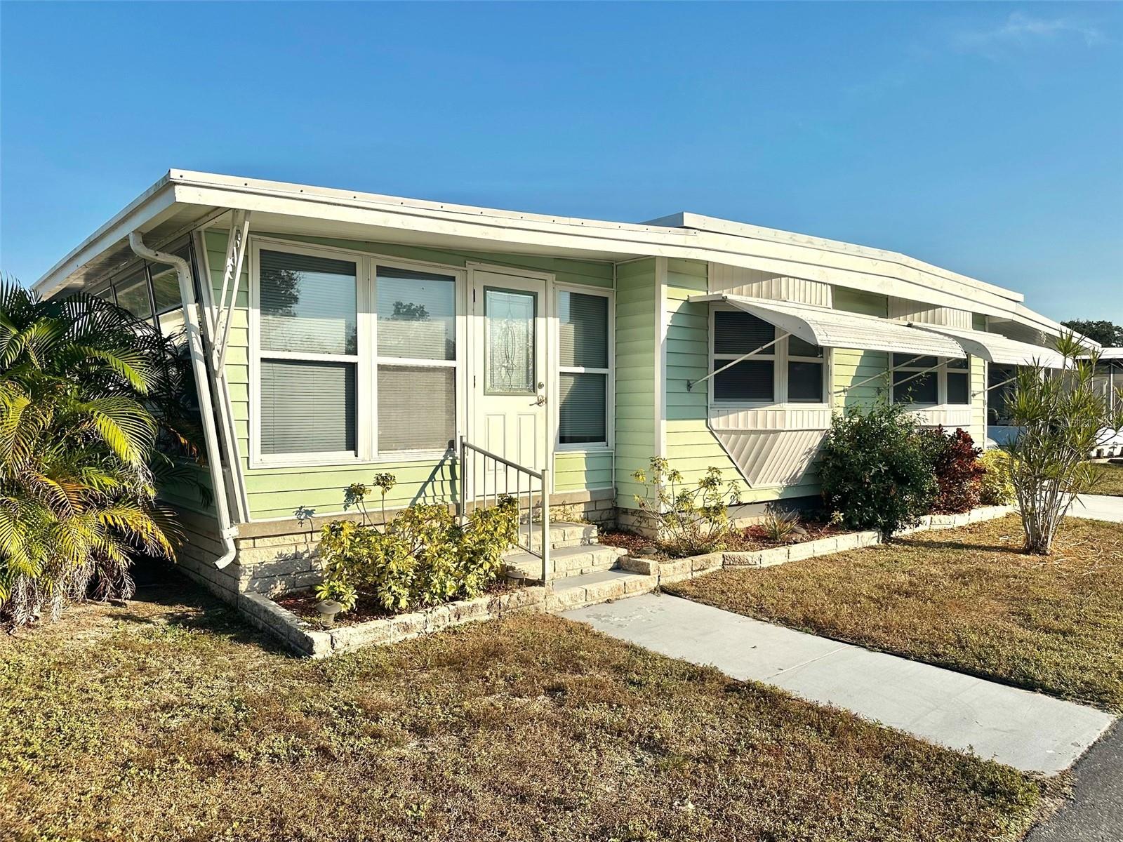 Come See this Super Deal forCome See this Super Deal for a Ready to Move In, 2 bedroom, 1 1/2, Spacious Doublewide, with added Glass Florida Room to enjoy! All beautiful laminate flooring, updated Interior Panel Doors, Central Air/Heat 11/21, mirrored closet doors, and much more! Convenient Washer/Dryer, and Workshop/Shed included! Attractive Furnishings, Rear Sun Deck, Insulated Double Roof, and Vinyl Siding! Covered Parking for 2 cars! This Inviting Beautiful Home, is located in the Popular, Active, 55+, 5 Star Resident Owned Community of Grosse Pointe. Walking distance to Largo Mall, only minutes to the beaches, golf courses, airports, Medical, Restaurants, and all you need! Cash only! Asking $134,500., includes the share! Low $178.83 mo. fee covers your water, sewer, garbage, yard, pool, and all the wonderful amenities!