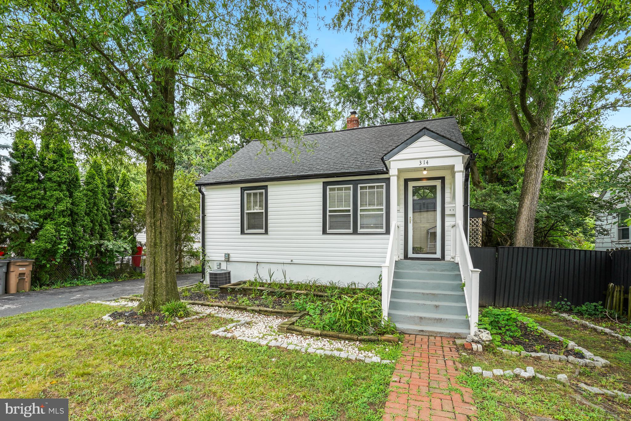 Looking for a home in a prime location with great schools on a beautiful 11,575 sf (.26 acre) level lot?  With over $81,000 in major renovation in June 2026, this property checks all the boxes.  The new storm door, vinyl siding and gutters and trendy paint inside and out totally transformed from the original.  Enter in the bright open living room that flows into an open concept dining and kitchen area.  A primary and second bedrooms are on the main level, as well as a full bath (2023).  The multi-purpose room to the left of the kitchen is your third bedroom, and flows out to  a huge deck ideal for al fresco dining or morning coffee.  The serene level backyard is great for relaxing, meditating or planting.  Back inside, the large open kitchen with windows on two sides letting in lots of natural light, and plenty of space for cooking and entertaining, has brand new appliances and cabinets (dishwasher is portable).  Upstairs the loft is spacious and private, good for an in-home office.  Downstairs has a brand new full bath (2026), laundry facility and a guest bedroom or den.  Newer electrical panel (2024).  Watch your head in the basement.  Whole house duct was cleaned 2026.  Parking for three cars on the driveway with ease, also has a newer EV charger (2024).  You are within walking distance to downtown Rockville’s restaurants, shops, library and night life.  It’s also a commuter’s dream with major routes and Metro just minutes away.  All this while living in a sought after Montgomery County neighborhood, and no HOA.  Make your appointment to see it today.