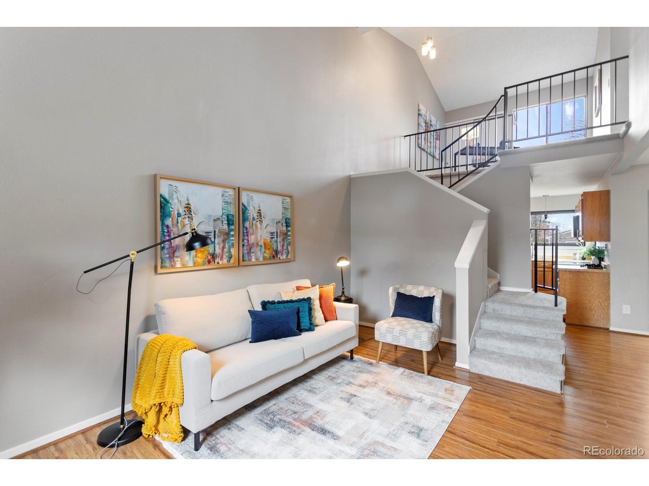 Welcome to a rare opportunity in Littleton where outdoor living truly sets this home apart. This charming townhouse offers something incredibly hard to find, a fully fenced front yard with ideal southern exposure, perfect for garden beds, morning coffee, or simply soaking up Colorado sunshine. Out back, enjoy your own private retreat with a covered patio, mature trees, blooming perennials, and plenty of space for pets to roam. Inside, you'll find a comfortable and functional layout with flexibility to fit your needs. The home currently lives as a one bedroom with a spacious loft, but the loft can easily be enclosed to create a second bedroom, offering instant added value and versatility. The kitchen and living spaces flow nicely for everyday living, and the newer LG washer and dryer are included for added convenience. Major updates provide peace of mind, including a new furnace and air conditioning system, plus a Class 4 impact resistant roof installed in 2024. The attached one car garage adds storage and convenience year round. The HOA keeps things simple and affordable, covering water, sewer, trash, and recycling, so you can spend more time enjoying your home and less time worrying about maintenance. With its unique outdoor spaces, flexible floor plan, and big ticket updates already completed, this is the one that stands out from the rest. A true Littleton gem offering comfort, potential, and a lifestyle buyers are searching for.