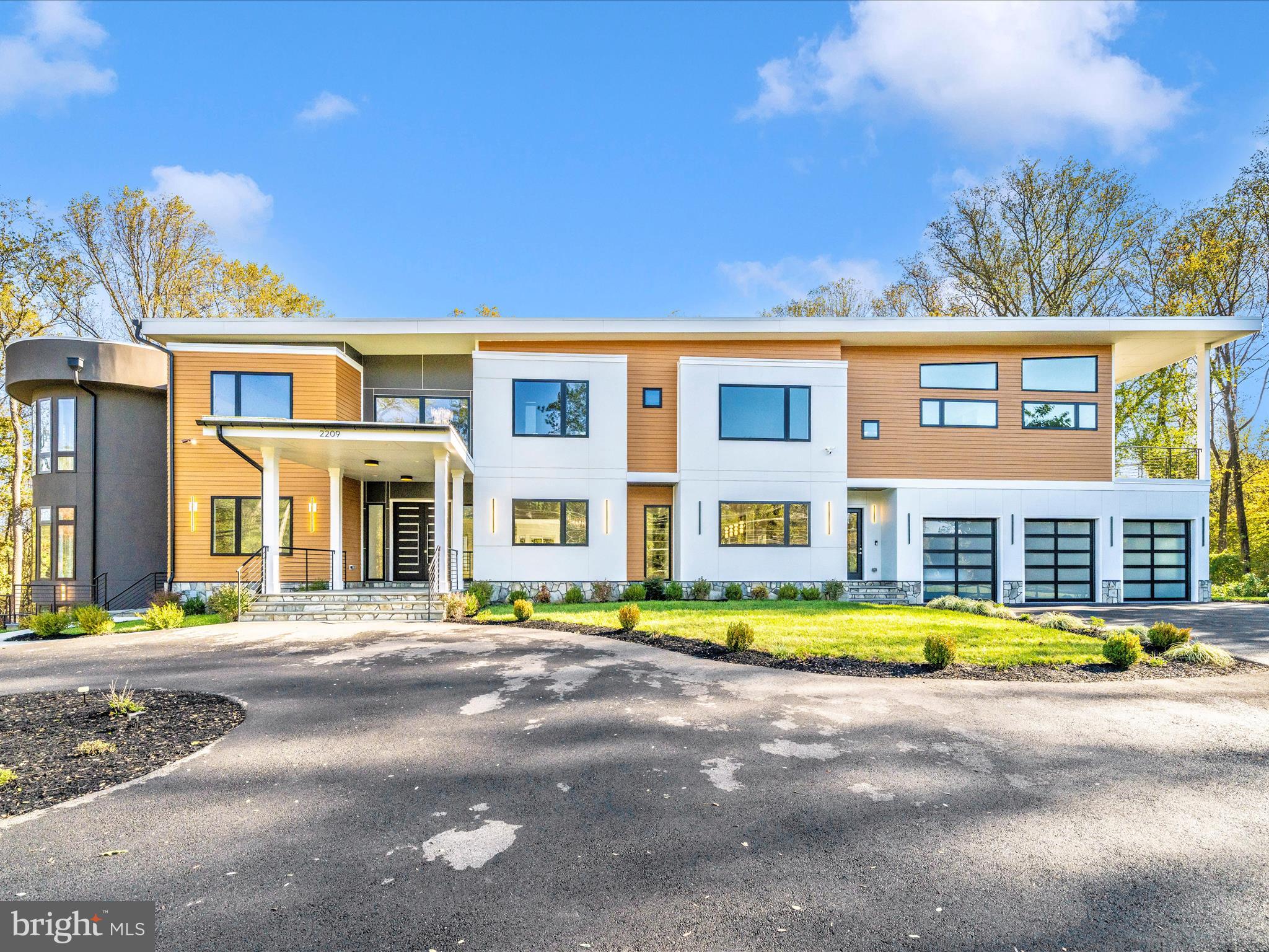 Immerse yourself in luxury living within this newly built, architecturally stunning 12,000+ square-foot estate set on 2.2 private acres in Northern Virginia. The grand 24-foot foyer makes a dramatic first impression, opening to an expansive modern floor plan designed for both sophistication and comfort.This custom residence showcases five generous bedroom suites, a chef-inspired gourmet kitchen with professional-grade appliances and a separate catering/spice kitchen, plus an impressive two-story office or conservatory that commands attention. Premium design elements include marble and hardwood flooring, sleek ribbon fireplaces, and exquisite crystal lighting throughout.Step outside to your personal retreat featuring a heated saltwater pool, elevated terraces, sprawling patios, and manicured landscaping ideal for entertaining or unwinding in total privacy.Additional amenities include a state-of-the-art home theater, fitness studio, elevator, three-car garage, wet bar, morning kitchen, and advanced smart-home automation. Convenient direct access to the catering kitchen makes hosting effortless.Perfectly situated near premier shopping, fine dining, acclaimed schools, and international airports, this estate redefines modern elegance—blending thoughtful design with unmatched comfort and convenience.