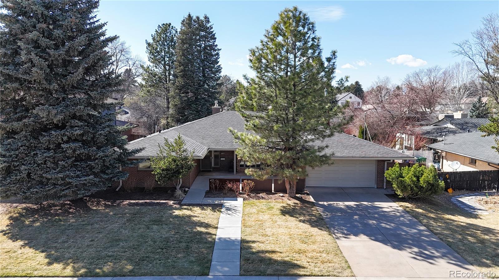 Wonderful and rare mid century 60's ranch in Crestmoor neighborhood. Thoughfully designed open floor plan has been lovingly maintained by the current owners. Wood floors and new custom carpet with 3 bedrooms and 3 bathrooms on the main floor. Custom vaulted coffered ceilings spacious, flexible area for dining and living with wonderful natural and custom lighting. Open concept, custom show kitchen that is wonderful for entertaining and keeping an eye on the kiddos.  Doors open to beautiful back yard with designer fire pit area and flat back yard. Awesome movie theatre in basement with chairs. Basement also includes 1 bedroom and 1 bathroom and a large family room. New carpet and newer boiler system and newly epoxied garage floor. 2nd filing of Crestmoor so preferrential application status to highly sought after Crestmoor Community Association and Tennis Club. Huge ranch style home in a fantastic location!