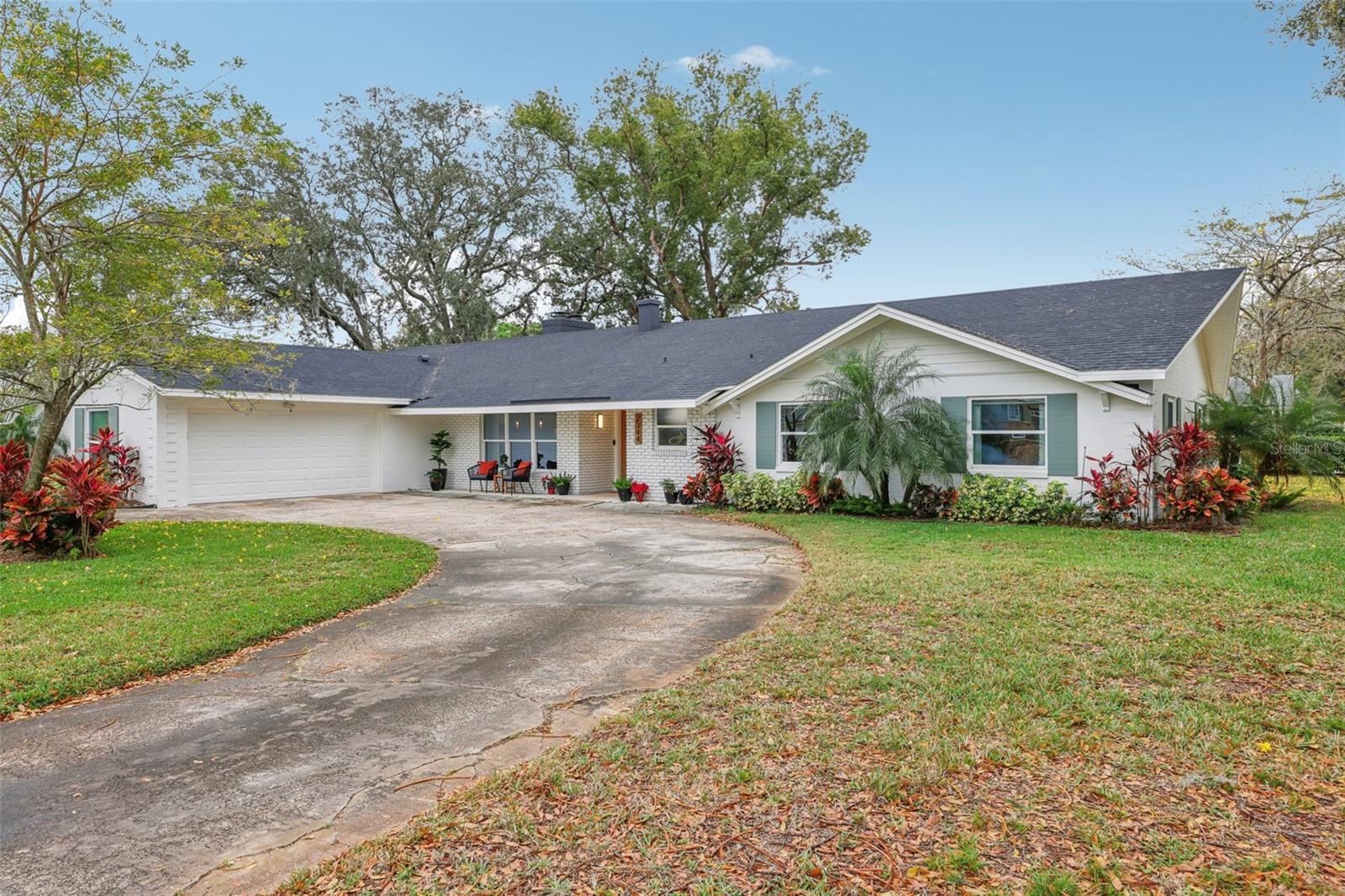 Welcome to this one-of-a-kind gem in the Maitland neighborhood of English Estates. Originally built in 1961 as the builder's model
home, this sprawling 2,649-square-foot ranch-style home has been tastefully and thoughtfully updated, offering a seamless blend of mid-century
charm and modern convenience. Situated on a beautifully landscaped CORNER .31 ACRE LOT, this property boasts a functional CIRCULAR DRIVEWAY and
2 CAR SIDE ENTRY GARAGE. Step inside and be captivated by the natural light that pours through the abundance of windows. The large dining room
at the front of the home offers views of the front yard, setting the stage for memorable gatherings. The open-concept kitchen has been updated
with GRANITE countertops, MODERN cabinets, and REFINISHED TERRAZZO flooring, which flows effortlessly into the inviting family room. From here,
sliding doors lead to a spacious screened patio and a FULLY ENCLOSED backyard. Walk through the family room into the living area that features a
DOUBLE SIDED FIREPLACE and backyard views. The primary suite features dual closets, backyard views, and an updated en-suite bathroom with a
walk-in shower. The secondary bedrooms are generously sized and share a stylish bathroom complete with a double vanity and a tub/shower
combination. Additionally, the OVERSIZED INDOOR LAUNDRY ROOM, which once served as the builder's office, offers ample space and includes a
convenient nearby half-bath. Significant UPDATES include modern WINDOWS, updated ELECTRICAL AND PLUMBING systems, new interior and exterior
PAINT, upgraded ATTIC INSULATION, beautifully refinished terrazzo floors, well for irrigation, A/C UNIT 2019, WATER HEATER 2017 and NEW ROOF TO BE PUT ON PRIOR TO CLOSING. Enjoy the unbeatable location
just minutes from downtown Winter Park, major expressways, shopping, dining, Kewannee Park, and the nearby bike trail. Don't miss your
chance to experience this extraordinary home! Schedule a private tour today and see firsthand why this property truly sets the bar in English Estates.