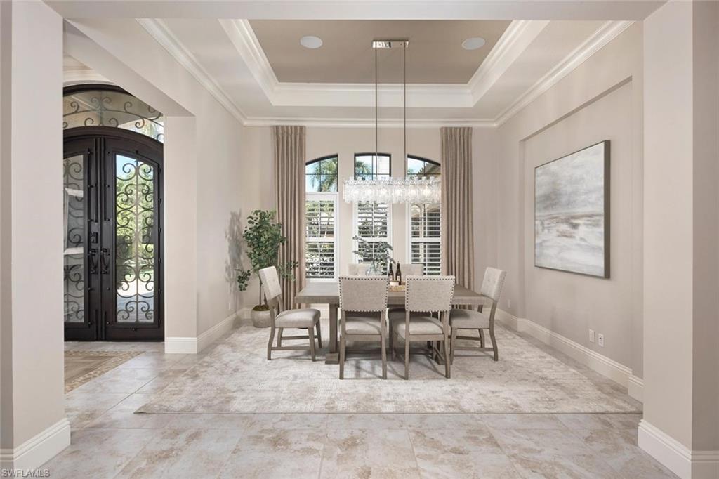 Designed for the Florida lifestyle, the home’s indoor spaces open effortlessly to a resort-style outdoor oasis featuring a newly updated pool and spa, outdoor kitchen, and covered sitting area, perfect for entertaining or quiet relaxation. Exquisite former model home in The Colony where sophisticated design meets modern comfort.Step through a stunning wrought iron entry into this impeccably designed former model home, offering 3 spacious bedrooms, 3 full bathrooms, a generous 3-car garage, and a versatile bonus room ideal for a den, media space, or guest suite. Built in 2015—making it one of the newest single-family homes in The Colony—this residence seamlessly blends timeless elegance with today’s luxury lifestyle. Thoughtful architectural details abound, from custom ceiling treatments to beautifully laid tile flooring that flows throughout the main living spaces. The open-concept floor plan is ideal for both entertaining and everyday living, with the heart of the home centered around a chef-inspired kitchen featuring gorgeous quartzite countertops, gas cooking, top-tier appliances, and a walk-in pantry designed to impress even the most discerning culinary enthusiast. Retreat to the expansive primary suite with dual walk-in closets and a spa-like bathroom complete with a soaking tub, separate shower, and elevated finishes. Two additional guest suites offer privacy and comfort for family and friends alike. The bonus room—with direct pool access and custom built-in cabinetry—offers incredible flexibility to suit your lifestyle.  Additional highlights include impact-rated windows and doors for peace of mind and energy efficiency. This is a rare opportunity to own a newer, meticulously updated home in the sought-after Colony community—where elegance, comfort, and lifestyle converge. The Colony Golf & Bay Club is a highly amenitized community to include a private island beach park, private dining at The Bay Club, fitness center, tennis, pickle ball, kayaking & sailing. Golf memberships optional. The community is situated in a highly sought after area of Southwest Florida, just minutes to the Intl. airport; super close to shopping and dining.