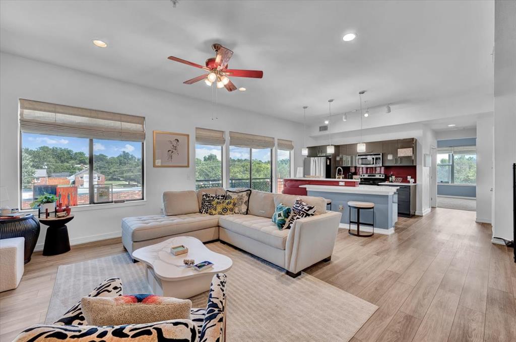 Experience the best of campus living in this beautifully maintained loft-style condominium at 401 Lofts! Ideally located just moments from the University of Oklahoma, Campus Corner, restaurants, shopping, and entertainment, this spacious 1,018-square-foot home is one of the largest one-bedroom floor plans in the building. Featuring an open-concept design filled with natural light, contemporary finishes, and a private balcony, this home offers the perfect combination of style, comfort, and convenience.The well-appointed kitchen features quartz countertops, stainless steel appliances, and ample storage, while the oversized bedroom offers a custom walk-in closet and views of Gaylord Family–Oklahoma Memorial Stadium—a daily reminder that you’re in the heart of Sooner Country. Step outside onto your private balcony to enjoy fresh air and views of the surrounding area. Just outside your front door, you’ll also find a private storage unit, providing convenient space for seasonal items, bicycles, or game-day gear. The refrigerator, washer, and dryer are all included, making this home truly move-in ready.Residents enjoy outstanding amenities, including a resort-style swimming pool, fitness center, game room, rooftop terrace with sweeping views of the OU campus and stadium, outdoor grilling area, fire pit, secure gated entry, elevator access, one reserved covered parking space, and guest parking.The HOA covers exterior maintenance, garbage service, gated entry, and pool maintenance, making ownership easy and low maintenance.Whether you’re looking for a primary residence, a game-day retreat, an investment opportunity, or housing for a University of Oklahoma student, this exceptional loft offers the perfect blend of comfort, convenience, a lock-and-leave lifestyle, and the unmistakable energy of campus living.