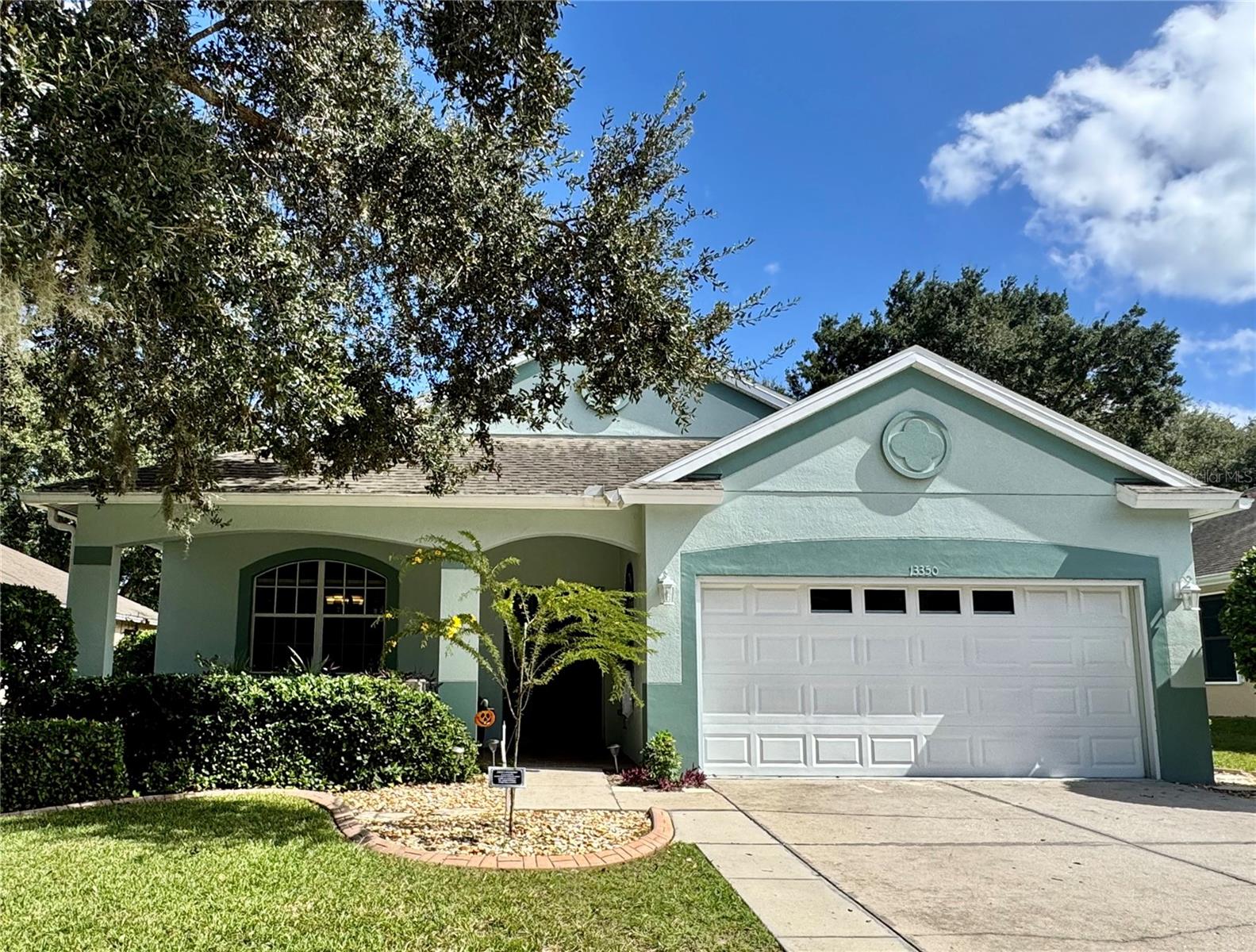 Exterior listing photograph: Golf-Course Home with a Screened Lanai in Hudson