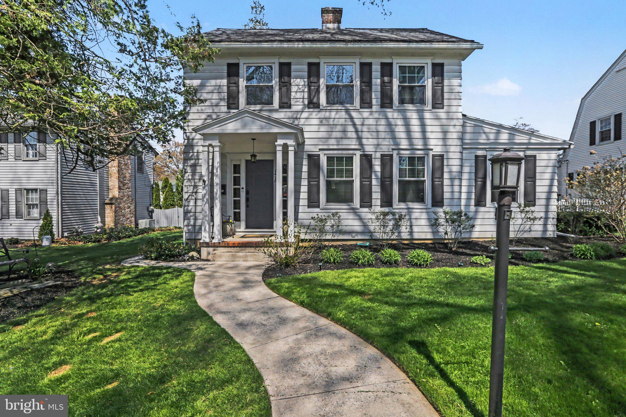 This stunning classic two-story home sits on a charming, tree-lined street in one of Camp Hill’s most sought-after neighborhoods — a true throwback community where children can still walk to school.  Ideally located, the home is just minutes from schools, libraries, parks, shopping, and everyday conveniences, offering the perfect blend of convenience and small-town warmth. Inside, the spacious living room welcomes you with gleaming hardwood floors, a handsome brick wood-burning fireplace, and a large picture window that fills the space with natural light. The generously sized dining room continues with the hardwood flooring and features an eye-catching chandelier and two built-in corner cabinets, creating the perfect setting for entertaining. Flowing seamlessly from the dining room is the beautifully updated kitchen, complete with rich cherry cabinets, granite countertops, a built-in breakfast table, breakfast bar, and convenient built-in desk. Stainless steel appliances remain with the home, making this the heart of everyday living. On the main level you will also find a spacious family room anchored by a gas fireplace and wrapped in expansive windows that frame views of the private rear yard. The rear yard is a true retreat, featuring an inviting inground sport pool, fire pit, and a one-car oversized garage. A main-floor bedroom with built-in shelves, and a large, organized closet that offers flexibility as a guest suite, home office, or playroom, while the adjacent full bathroom provides a tub/shower combination with ceramic tile surround and a linen closet. Upstairs, three generously sized bedrooms await, each with ample closet space. One bedroom offers direct access to a full walk-up attic, providing exceptional storage. All three bedrooms share easy access to the main second-floor bathroom, which features a double-bowl vanity, tub/shower combination with ceramic surround, and a hallway linen area with built-in drawers. Completing this wonderful home is a full basement that includes a laundry area with a washer, and dryer, a utility sink, a freezer and a private room with commode. Warm, updated, and perfectly situated, 2418 Harvard Avenue is ready for its next chapter. Schedule your private showing today and experience everything this special Camp Hill home has to offer. Truly a wonderful place to call HOME!