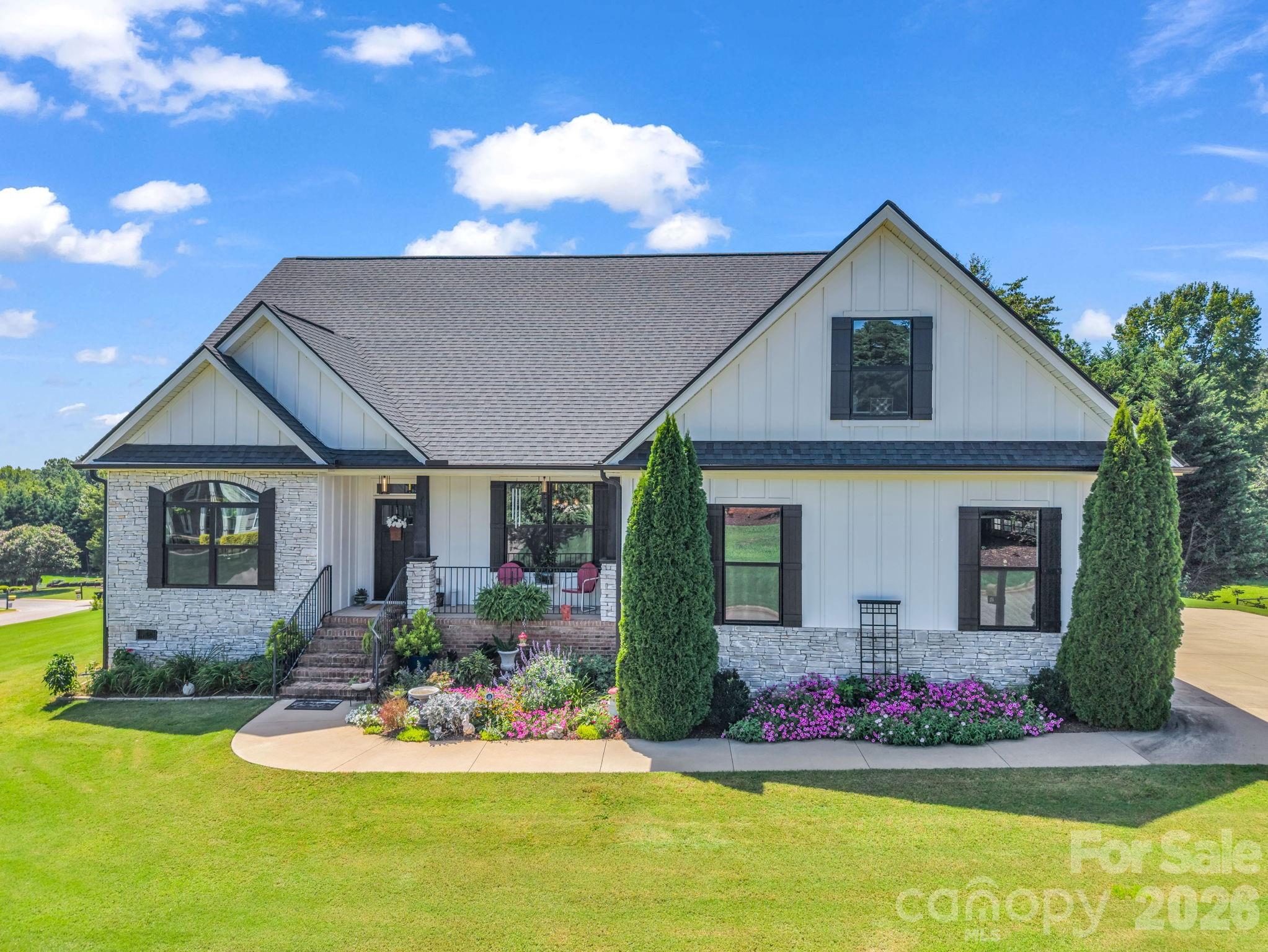 Welcome to 718 Tinsberry Lane, a beautifully maintained 3-bedroom, 2-bath home with a room over the garage, offering 2,421 square feet of thoughtfully designed living space. Built in 2020 and meticulously cared for, this home feels like new and is truly move-in ready. Conveniently located to downtown Inman.The open floor plan creates an inviting flow between the spacious living areas, while a separate dining room provides the perfect setting for gatherings and special occasions. Hardwood floors extend throughout the main living areas, adding warmth and timeless appeal. The well-appointed kitchen opens to the living space, making everyday living and entertaining effortless.Step outside to enjoy the screened-in porch overlooking the beautifully maintained 0.56-acre corner lot. Perched on a gentle knoll, the property enjoys a refreshing breeze and a peaceful setting. An irrigation system helps keep the yard looking its best with ease.Upstairs, the versatile bonus flex over the garage offers valuable additional space for a home office, media room, hobby area, or whatever best suits your needs.Located in Cumberland Walk, a well-established community known for its quality homes and attractive surroundings, this property offers the combination of a newer home, a generous lot, thoughtful updates, and exceptional care. If you're looking for a home that has been lovingly maintained and offers both comfort and space inside and out, 718 Tinsberry Lane is one to see.