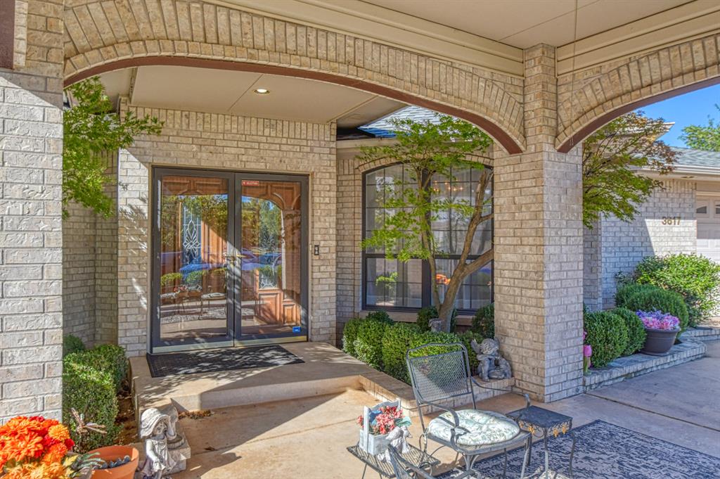 Welcome to 3617 Hampton Court  nestled in a quiet Cul-de-sac close to all your favorite shops and restaurants. This spacious home features 3,505 of living space with 3 living areas, study, 4 bedrooms and 2 and a half bathrooms. Step inside to the first living area with a gas fireplace that is shared and separates the second living area. Off the first living area is the formal dining room and the study. Step into the second living area and enjoy that same fireplace with bookshelves on each side. The spacious kitchen is open to this second living area with lots of room to cook and plenty of cabinets for storage. The island serves as work space or seating for meals.  The Florida room is also off the second living area and this room would be great for so many things with its  vaulted ceilings and 3 sliding doors with so much sunlight coming through. The primary suite which is located downstairs is a true sanctuary, offering a luxurious en-suite bathroom with double vanities and generous closet space with laundry room inside the closet. The Additional bedrooms which are located upstairs are spacious with walk in closets. The bathroom upstairs is truly amazing with double vanities including a sitting area to get ready. The tub is a large soaking with shower. You will also find a second laundry room upstairs so no hauling laundry downstairs.  The front of the home has a covered parking area or use it for a large covered patio. Out back you will find a deck the whole length of the back of the home.  This home is in impeccable condition, showcasing an abundance of natural light through numerous windows. Recent updates include a roof that is two years old, two separate HVAC systems that were installed in 2024.