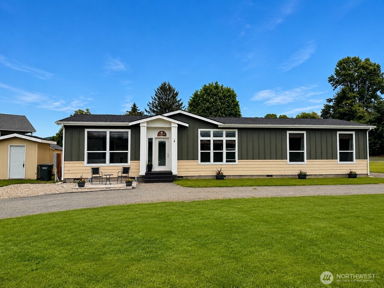 Welcome to charming Cathlamet, WA! This nearly new 2021 manufactured home sits on 1 acre in a wonderful neighborhood, with public fishing access on the Elochoman River just across the road—perfect for winter steelhead fishing. Inside, enjoy a bright, open single-level floor plan with tall ceilings, a spacious kitchen featuring a large island, quartz countertops, beautiful cabinetry, and a hidden oversized walk-in butler's pantry. The primary suite offers a walk-in closet, soaking tub, and large shower. Complete with a private well, 8x10 storage shed, and plenty of space to build a garage or shop while still enjoying the outdoors. $5,000 closing cost credit to use how you choose with a full price offer! Move-in ready and affordably priced!