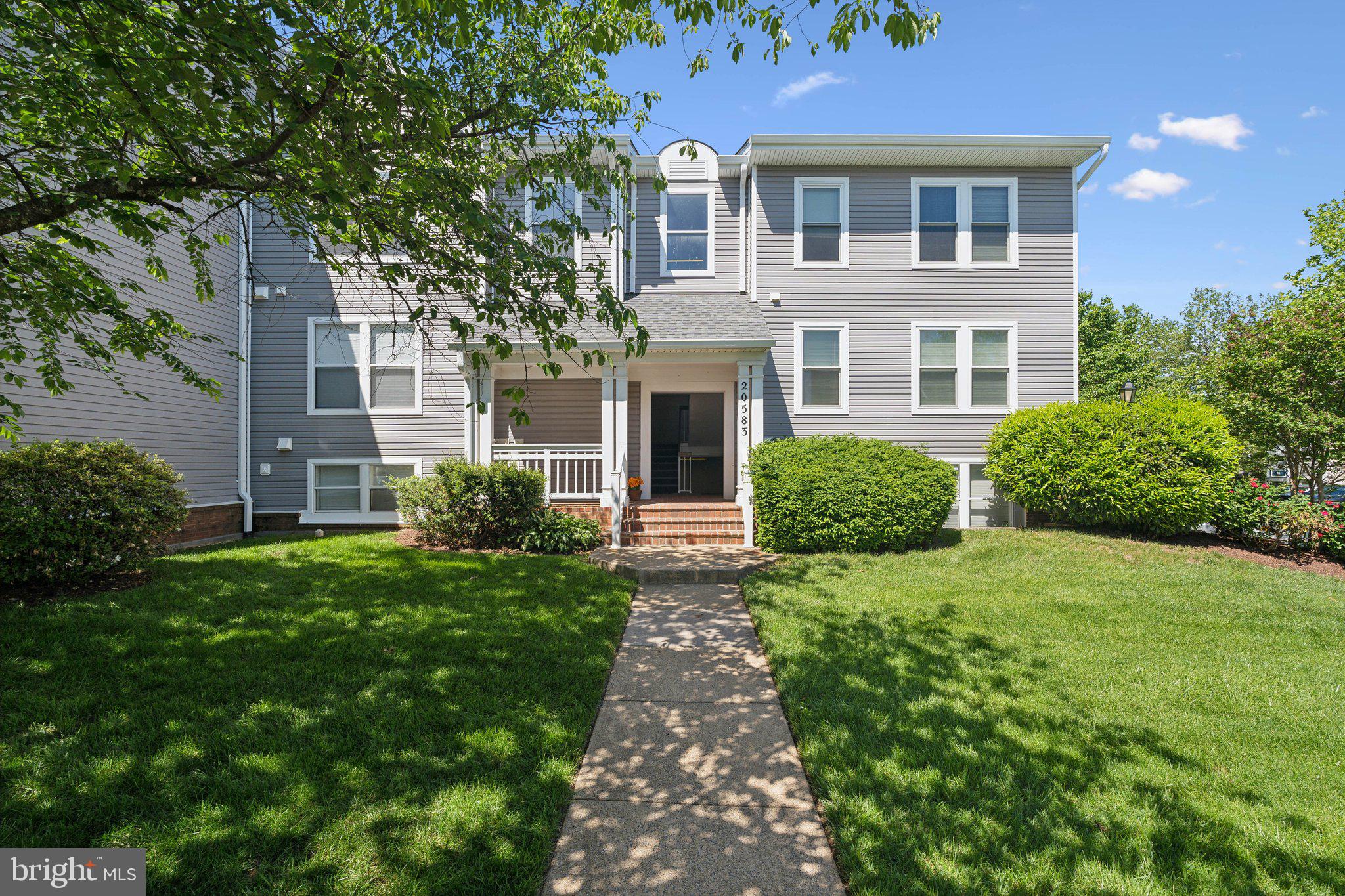 Top-floor Ashburn Village condo with breathtaking lake views! This beautifully updated 2-bedroom, 2-bath home features soaring vaulted ceilings, abundant natural light, newer paint, newer flooring throughout, and two fully renovated bathrooms. The open-concept living and dining areas are anchored by a cozy gas fireplace and open to two private balconies overlooking the serene lake—perfect for relaxing or enjoying your morning coffee.The thoughtfully designed layout offers two spacious bedroom suites, each with its own newly renovated full bathroom, providing exceptional privacy and flexibility for guests, roommates, or a home office.Enjoy Ashburn Village's exceptional lifestyle with access to the renowned Sports Pavilion featuring indoor and outdoor pools, fitness center, tennis, pickleball, basketball, racquetball, and more. Explore 17 miles of scenic walking and biking trails, multiple lakes and ponds, playgrounds, parks, and year-round community events.Ideally located just minutes from Route 7, Route 28, the Dulles Toll Road, Silver Line Metro, One Loudoun, shopping, dining, and entertainment. Don't miss this rare opportunity to own a move-in-ready lakeside retreat in one of Ashburn's most desirable communities!