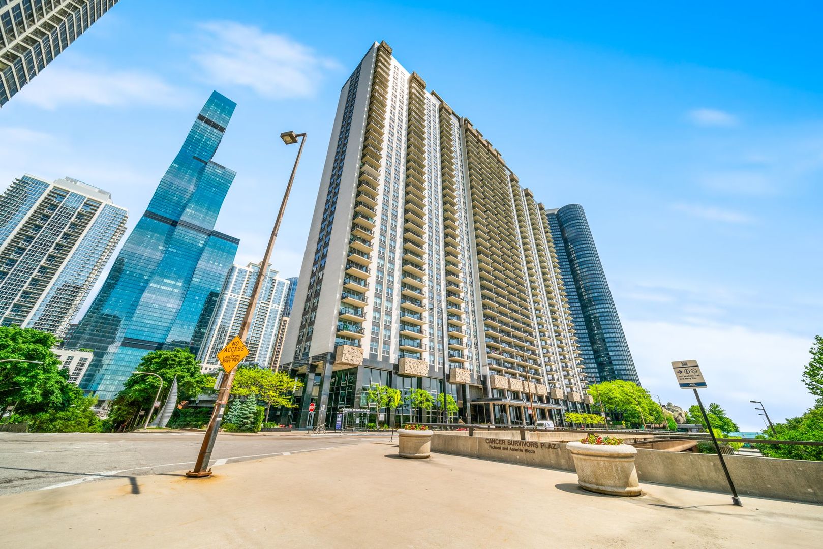 Multiple offers received. Best and final offers due by 12 noon Friday, August 8. Step into a gorgeous corner unit like no other at 400 E Randolph #2119. This two bed, two bath oasis high above the city offers sweeping southern and western views of Millennium Park, Lake Michigan, and Chicago's dazzling skyline. From your private balcony, watch sailboats drift across the lake and take in the lush greenery of the park below.  It's an ever-changing view that feels like living in a postcard. Inside, fresh finishes and timeless charm infuse every room with warmth and character, creating a home that's both inviting and unique. Massive windows frame breathtaking views from every angle, flooding the space with natural light by day and city sparkle by night. The building itself is a true amenity haven: enjoy a fitness center, spa, sauna, hot tub, glass dome covered pool, plus a massive sundeck, party room, and a BBQers dream outdoor space that's perfect for gatherings. Set in Chicago's desirable Lakeshore East, this home offers a rare blend of tranquil park-and-lake feel with vibrant city living right at your doorstep. With its charming interior, world-class amenities, and iconic vistas, this is high-rise living at its most enchanting. Come see for yourself!