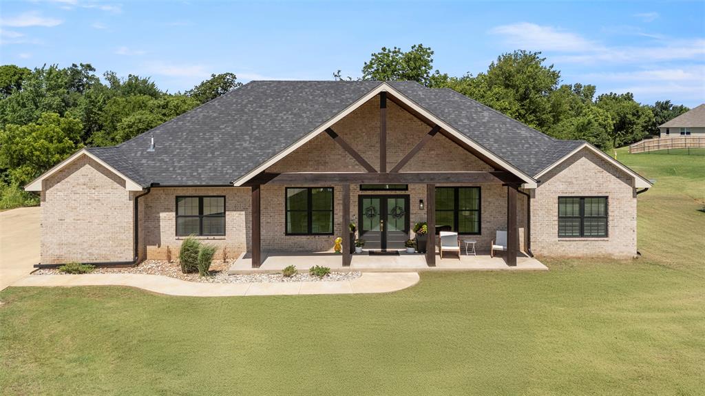 Beautiful custom-built home on 1.23 wooded acres (MOL) in the desirable Fawn Lake addition with pond access. This 4-bedroom, 2.5-bath home offers the perfect blend of modern design, space, and privacy.The open-concept layout features granite countertops, abundant cabinetry, a walk-in butler’s pantry, formal dining area, and breakfast nook, all centered around a spacious living room with an electric fireplace and Andersen energy-efficient windows that bring in natural light.The private primary suite includes his-and-hers walk-in closets, walk-in shower with Bluetooth speaker lighting, freestanding soaking tub, makeup vanity, and LED-lit mirror.The three additional bedrooms feature oversized closets, and the home offers extra storage throughout. Exterior highlights include cedar accents, covered front porch, covered back patio overlooking the trees and pond, large concrete driveway, and 9-ft garage doors.Additional upgrades include spray foam insulation throughout (including attic), new gutters (2025), tankless water heater, owned water softener, built-in security system, in-ground storm shelter, and 36” doors throughout for accessibility.Conveniently located just minutes from Highway 62 with easy access to the OKC metro, while still offering peaceful acreage living.