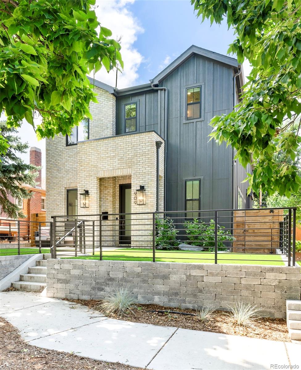 Modern build nestled in Congress Park • Soaring Ceilings • Thermador appliances  •Floor-to-Ceiling Sliders to the backyard• Finished basement with a wet bar • 9+CO & Cherry Creek accessElevated above the sidewalk on a tree-lined Congress Park block, this newer-construction home blends clean-lined design with functional living across three finished levels. A gated front yard and covered porch lead to a wide entry and dedicated main-floor office. The open-concept main level features 10-foot ceilings and seamless connection between the living, dining, and kitchen areas. The kitchen includes Thermador appliances, Calacatta-style quartz countertops with full-height backsplash, farmhouse sink, abundant cabinetry, statement lighting, a eat-in area and mudroom. Oversized sliding glass doors open to a covered patio and fully fenced yard. A powder bath completes the main floor.Upstairs, the primary suite features large windows with cascading natural light, two walk-in closets with custom California Closets systems, and a five-piece bathroom with dual vanities and soaking tub. Two additional bedrooms include one en-suite bath, one hall bathroom, an upper-level laundry room and lofted space perfect for a gym or home workspace.The finished basement offers a rec/media room, wet bar, conforming bedroom, and guest bathroom — flexible for gym, studio, or lounge space. Low-maintenance fenced yard with covered rear patio for outdoor dining and entertaining.Just blocks from Denver favorites including the 9+CO retail and dining district (approx. 0.5 mi), Cherry Creek Shopping Center (approx. 1.7 mi), Congress Park (approx. 0.6 mi), Carla Madison Recreation Center (approx. 0.7 mi), and Denver Botanic Gardens (approx. 0.9 mi), this home offers a rare combination of elevated design and vibrant city living.