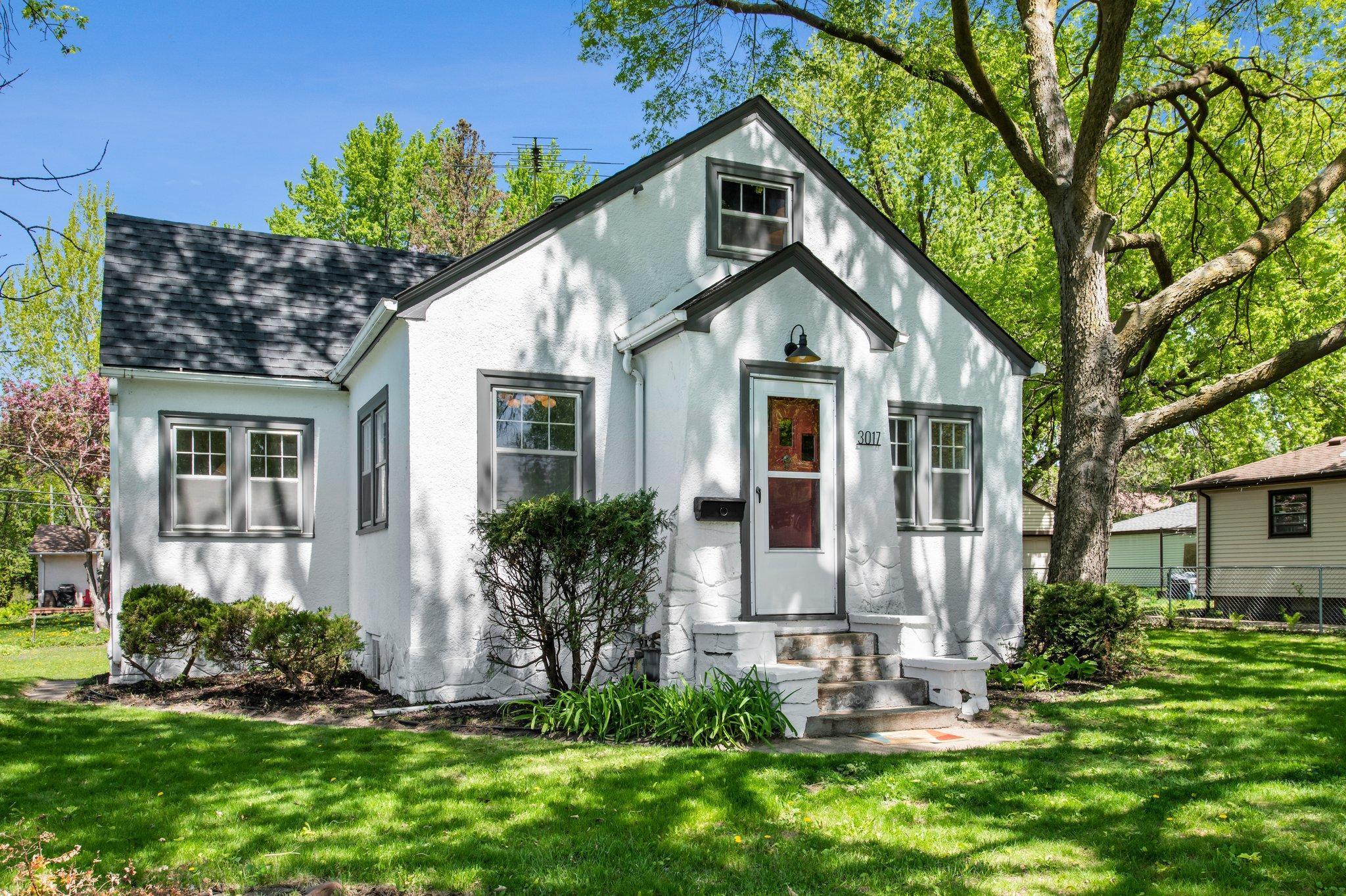 Discover this beautifully updated 3-bedroom, 1-bathroom home nestled in a peaceful neighborhood near St. Anthony Middle School, Gross National Golf Club, several parks, and a variety of dining options. Step inside to a welcoming living room featuring newly refinished classic hardwood floors, abundant natural light from multiple windows, elegant crown molding, and modern lighting that enhances the timeless character of the space. Arched doorways add architectural charm, while a Honeywell smart thermostat provides modern convenience. The living area flows seamlessly into the kitchen, where hardwood continues underfoot. The kitchen boasts a stylish tile backsplash, updated lighting, ample cabinet space, and serene views of the yard. Recent kitchen upgrades include freshly painted cabinetry, new flooring, countertops, lighting, hardware, and appliances—perfectly blending function with style. Adjacent to the kitchen is a formal dining area, surrounded by windows and illuminated by a sleek, contemporary light fixture. Ideal for everyday meals or hosting guests, the space reflects the home's blend of character and comfort. Throughout the main level, you'll find newly refinished wood flooring, updated carpet, fresh paint, and new lighting. Two main-floor bedrooms offer generous space, plenty of natural light, and hardwood floors, along with additional closets for storage and organization. The full bathroom is conveniently located nearby and features tile flooring, a tub-shower combo with tile surround, a new vanity with updated fixtures, and a hallway cabinet for extra storage. Upstairs, the versatile upper-level space with arched ceilings, two closets, and rich wood flooring is perfect as a third bedroom, home office, or cozy bonus room. The lower level is currently unfinished, offering a laundry area with a utility sink and ample potential for future expansion to suit your needs. Outside, enjoy an attached 1-car garage, refreshed exterior paint completed in 2025, updated siding wrap, new garage door and lift, and a new roof. Mature trees and thoughtful landscaping throughout the large lot enhance curb appeal, while recent mechanical updates—air conditioning, furnace, and water heater—add peace of mind for years to come. This home combines classic charm with modern updates in a serene location—ready for you to move in and make it your own!