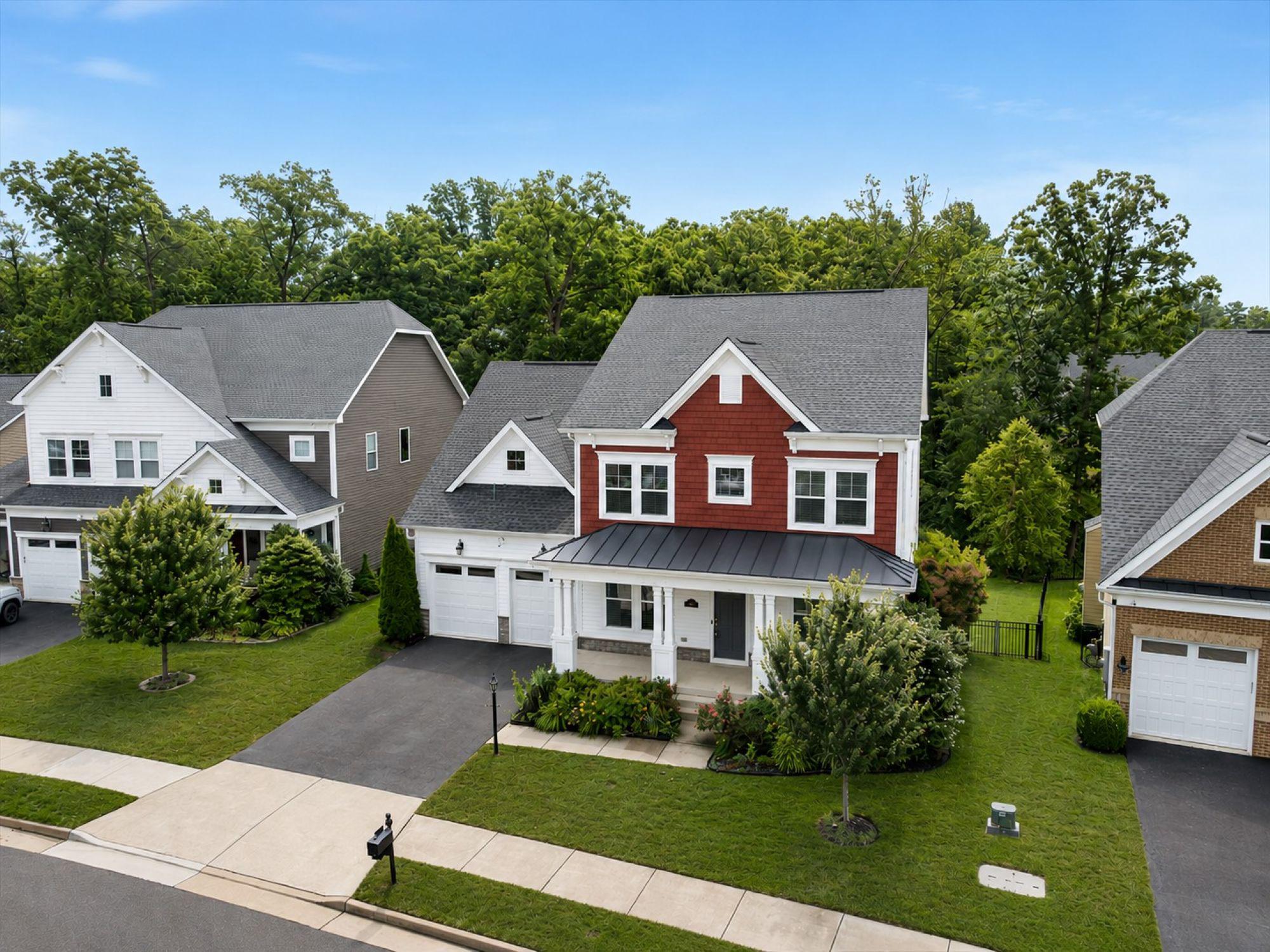 Rare opportunity in one of Aldie's most established, low-turnover communities - Westbury Glen.The best homes don't just meet your needs today; they leave room for the life you'll grow into tomorrow. Built in 2017 on a private 0.21-acre lot backing to mature trees, this beautifully maintained Lennar Chamberlain-model home offers 4,460 finished square feet, five bedrooms, and 5.5 baths across three thoughtfully designed levels.A standout main-level bedroom with a full en-suite bath offers rare flexibility rarely found in homes at this price point - ideal for extended family, aging parents, or overnight guests who want their own private retreat without stairs. Upstairs, the primary suite anchors a spacious secondary level with three additional bedrooms, three full baths, a laundry room, and a private flex room behind French doors - perfect for a home office, media room, or creative studio. The finished walk-out lower level continues the home's versatility with a large recreation room, full wet bar, a private bonus room adjacent to a full bath, and an unfinished area currently used as a home gym.The heart of the home is a gourmet kitchen with soaring cabinetry, a dramatic waterfall-edge island, a butler's pantry, and a walk-in pantry, flowing seamlessly into a family room with a cozy gas fireplace. Outside, enjoy a fully fenced backyard and custom composite deck backing to mature trees — a rare sense of privacy for the neighborhood.Thoughtful updates provide peace of mind: 2021 HVAC system, 2022 whole-home water purification system, new washer/dryer (2025), professionally power-washed exterior (2025), ADT security system, Ring floodlight cameras, and Ruckus Wi-Fi access points throughout. A 2-car attached garage with front entry rounds out the home's everyday functionality. Low $91/month HOA covers trash and snow removal — no amenity assessments, no surprises.Zoned for some of Loudoun County's newest schools — Lightridge High School (ranked #22 in Virginia and top 5% nationally by U.S. News), Willard Middle School, and Hovatter and Henrietta Lacks Elementary Schools.Whether you're welcoming extended family, embracing multigenerational living, or simply creating room for life's next chapter - this home is designed to grow with you, in one of Aldie's most welcoming communities.
