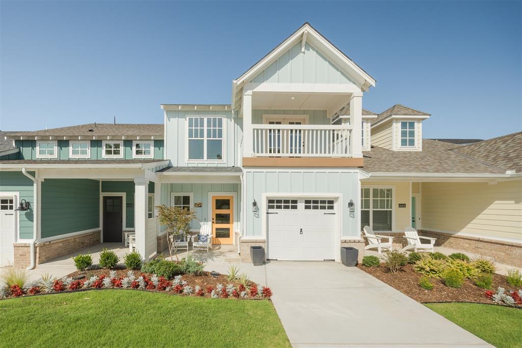 Come experience coastal-style living in Bungalow Heights with water views off your deck with this move-in ready home! This lock-and-leave lifestyle townhome community is one you won't want to miss out on. Bungalow Heights is a coastal-inspired townhome community that is gated with a clubhouse, fitness center, resort pool, outdoor entertaining spaces, and a lake with walking trails. This one and a half story home in our Catalina plan will make you feel like you are on the coast with its adorable upper balcony and light blue exterior with a happy tangerine orange front door! Our Catalina plan has a very special floor plan as it features two master bedroom suites with one downstairs and one upstairs with a walk-out covered balcony that has view of the community lake. Go ahead and sell that lawnmower of yours because in Bungalow Heights you will never have to mow your lawn again with our lock-and-leave lifestyle which includes yard maintenance. You are going to Love Where You Live in Bungalow Heights!