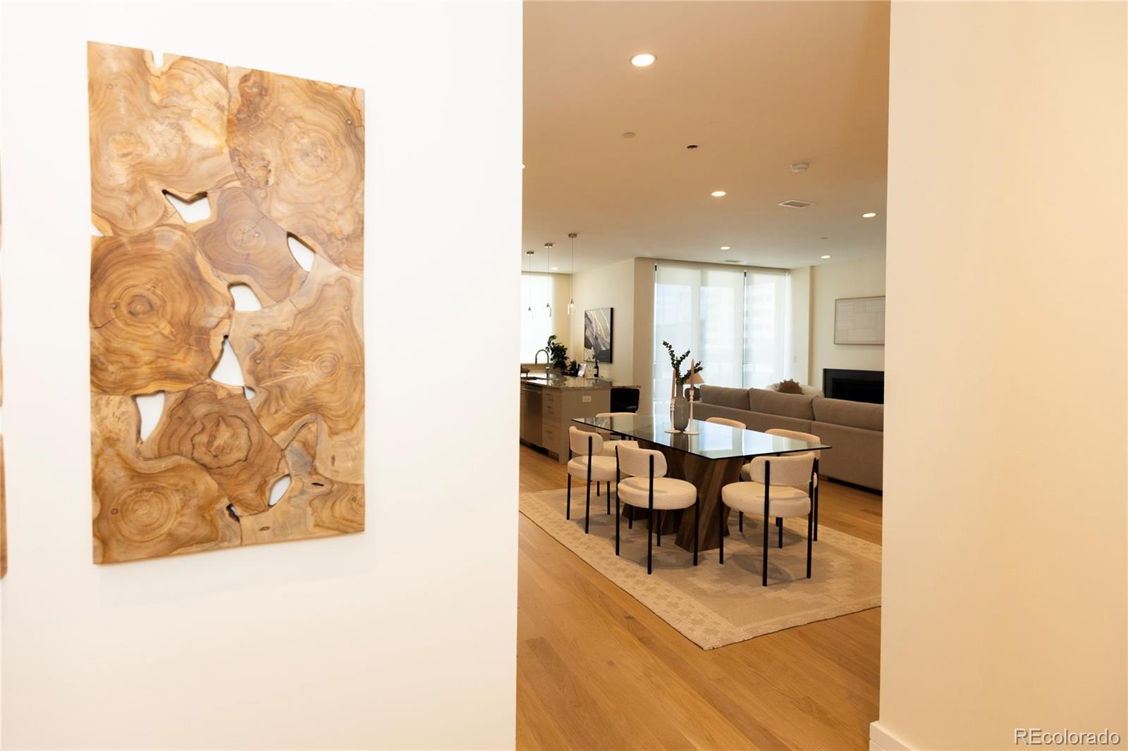 A rare corner unit is available on the third floor of 250 Columbine. It features an open floor plan with great light and a wraparound patio. The kitchen has a great kitchen island and dual ovens for entertaining. The doors to the patio can be completely folded out of the way to create a unified indoor / outdoor space. The inside features a gas fireplace and the patio is perfect for grilling with a natural gas line already installed. The building features a bike room, a fitness center, and a roof deck with great views of the mountains, a hot tub, shaded grilling area, and lots of seating. This is an amazing space in an amazing location! The unit comes with 2 spaced in a secured garage and a storage unit.