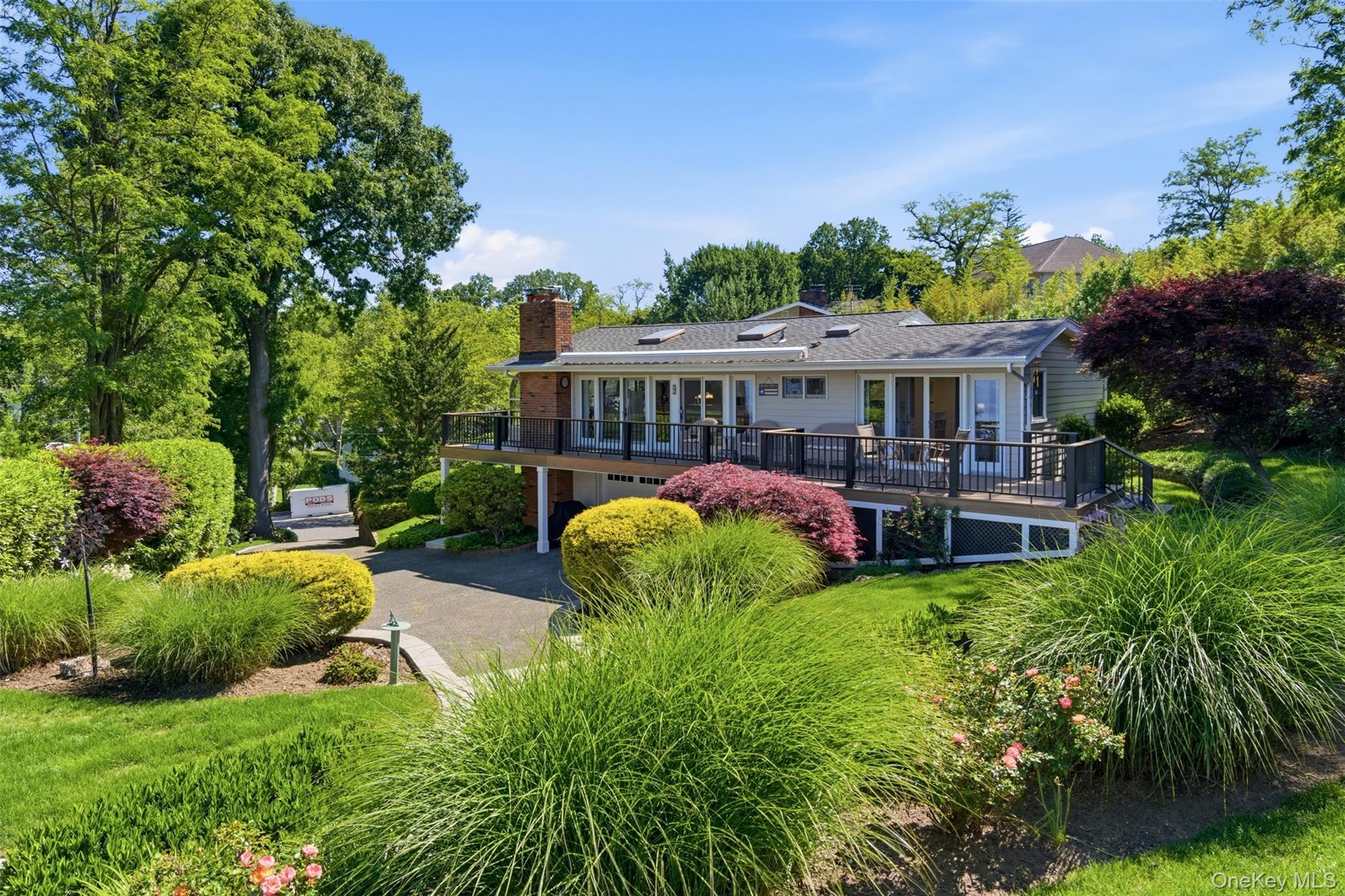 Nestled on .49 acres of beautifully landscaped property in Eatons Neck, this updated waterfront residence offers approximately 69' feet of bulkhead with direct water access and sweeping western views of Lloyd Neck and Connecticut. Enjoy spectacular sunsets year-round from the expansive Trex deck, complete with an automatic awning, or through the wall of sliding glass doors that seamlessly connect indoor and outdoor living. This well-maintained home features 3 bedrooms and 3 full baths, including a spacious primary suite with a private bath. The sun-filled interior offers an abundance of natural light, a wood-burning fireplace, hard wood floors, generous storage throughout, a dedicated laundry room, and a thoughtfully updated interior with well-appointed living spaces. Additional amenities include an above-ground oil tank and a 2.5-car garage. Optional membership to the PONB Association is available (dues required). Conveniently located approximately 6.1 miles from the heart of Northport Village, where you'll find the Engeman Theater, seasonal Saturday farmers market, waterfront park, boutique shopping, and acclaimed dining. Less than one hour from New York City and approximately 8 miles from the train, this exceptional waterfront property offers a unique opportunity to enjoy boating, breathtaking views, and the North Shore lifestyle.